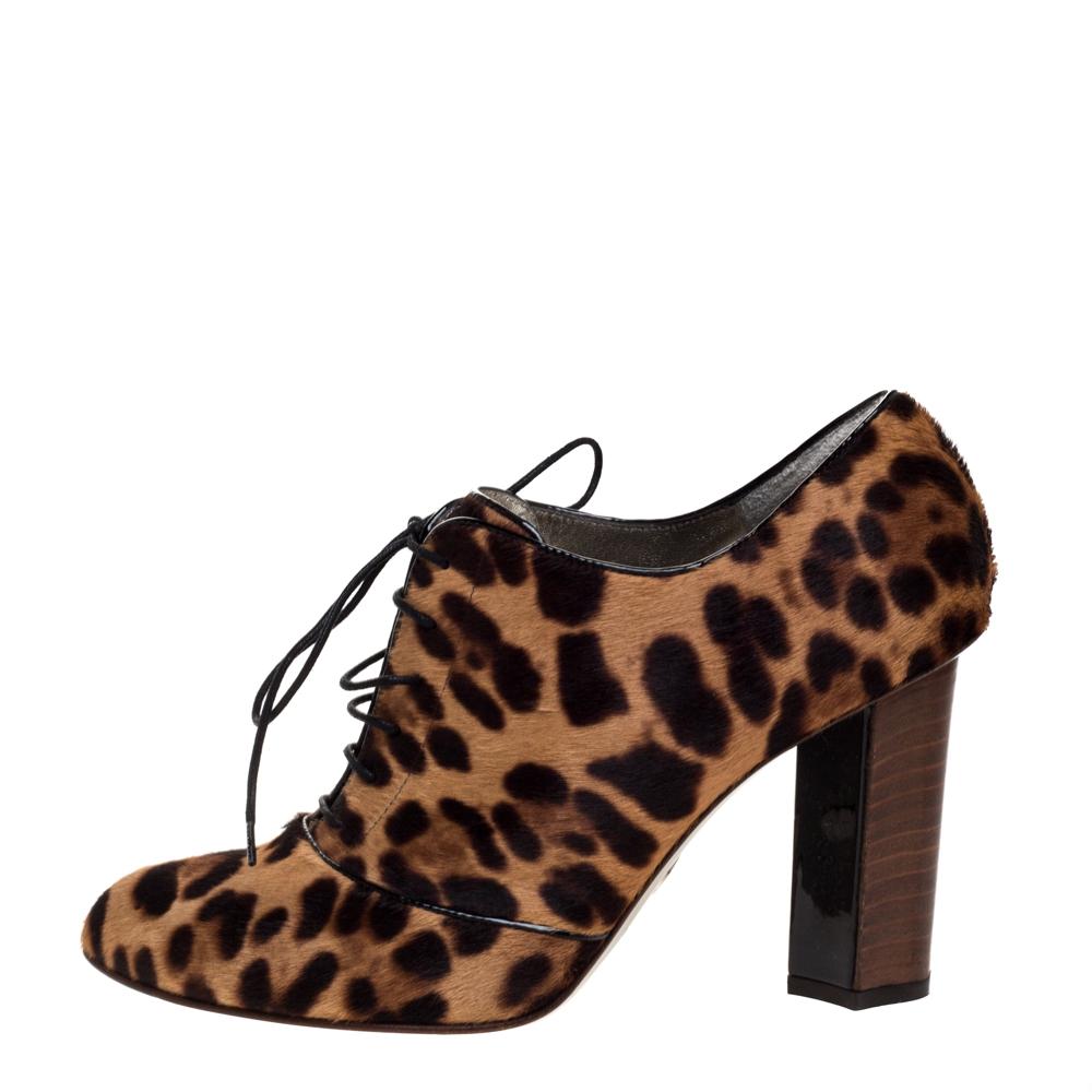 n a bold leopard print, these booties are from the house of Dolce & Gabbana. They feature a pony hair exterior. Almond toes, lace-up on the vamps, and block heels complete this lovely creation. These shoes lend themselves to work and evening looks