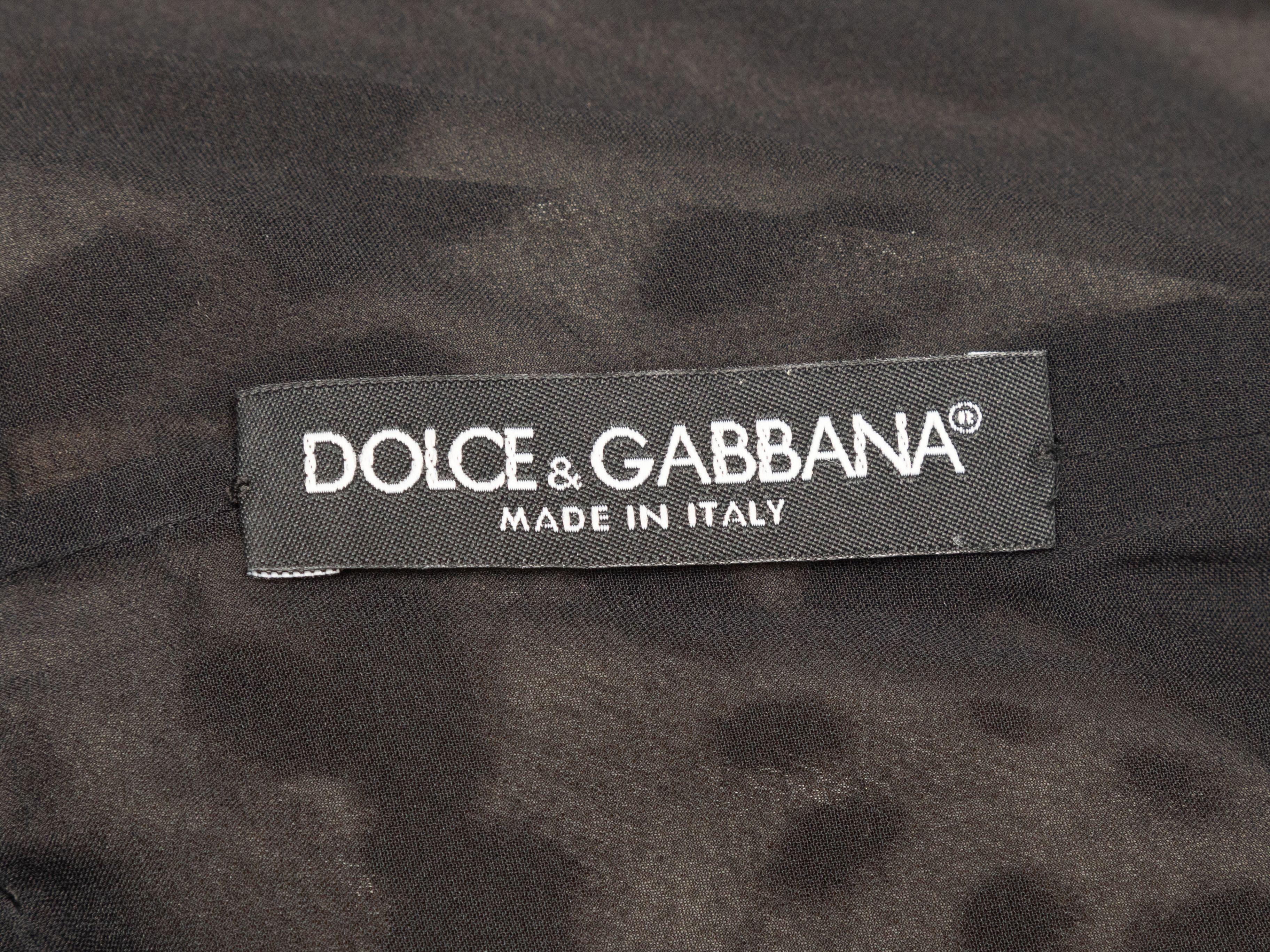 Product Details: Brown and black leopard print fitted knee-length dress by Dolce & Gabbana. Square neckline. Short sleeves. Zip closure at center back. 30