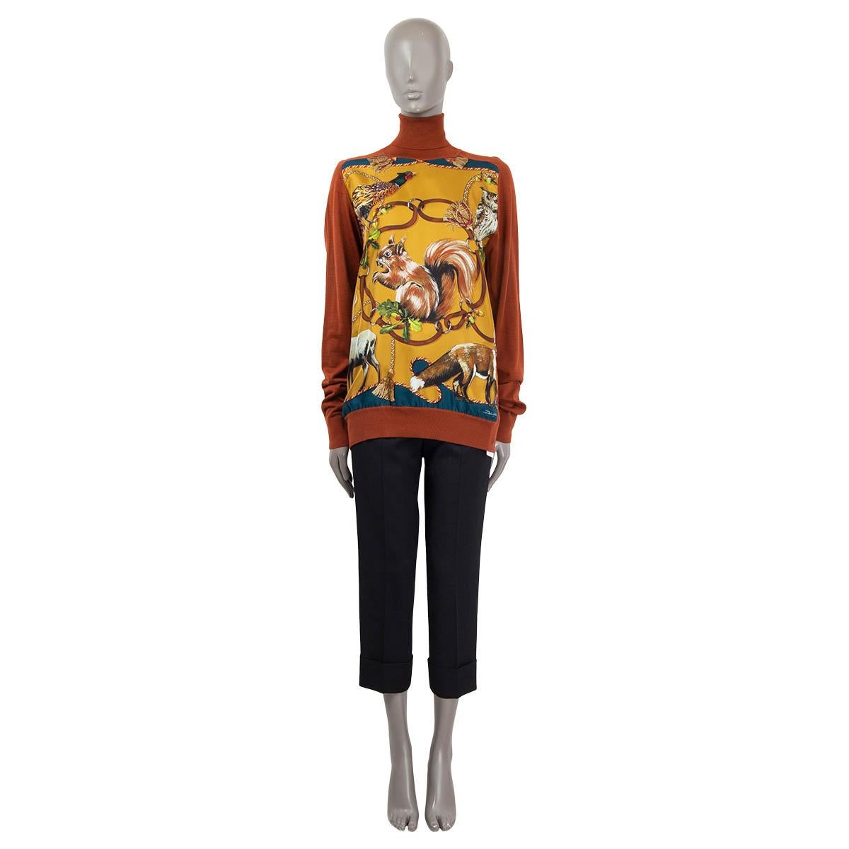 100% authentic Dolce&Gabbana light turtleneck in cashmere (60%) and silk (40%) with a hunting pattern on the front in rust, mustard, brown, green and black. Has been worn and is in excellent condition. New with tags.

2014