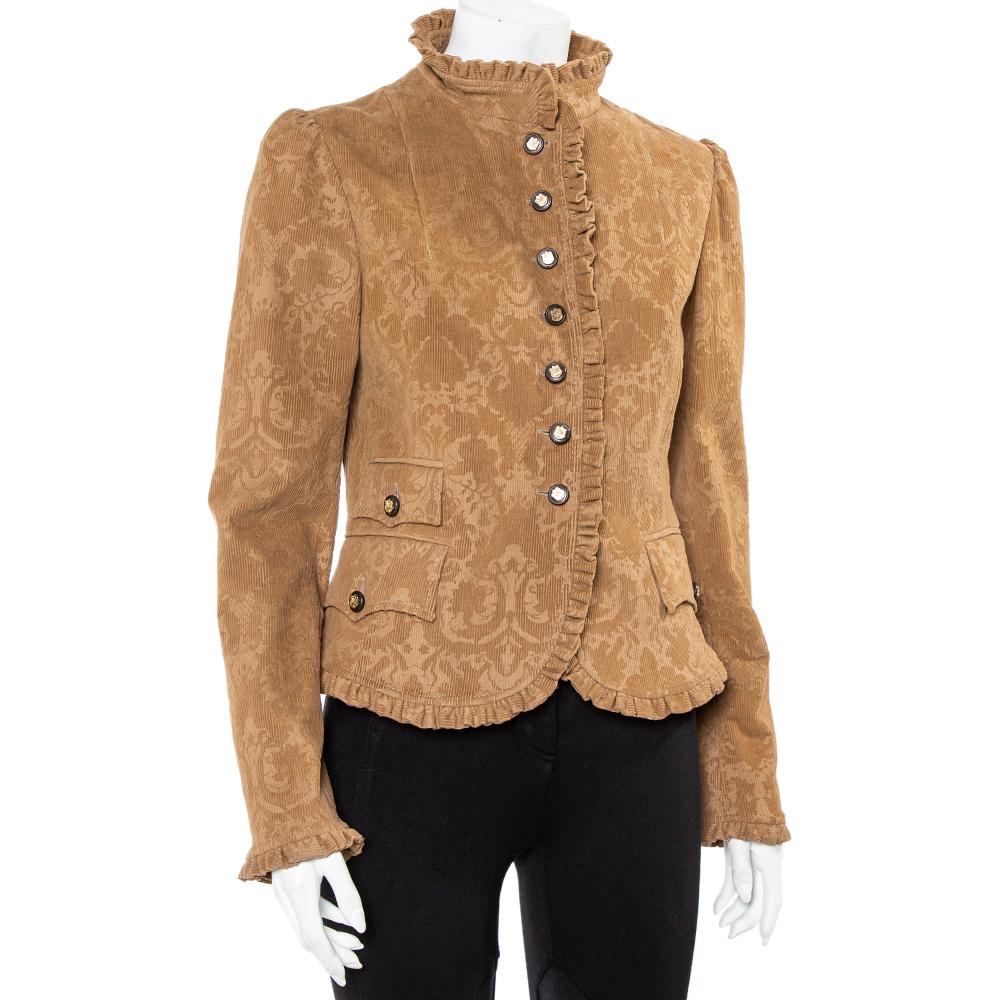 With such a chic and smart jacket, you are sure to make a statement! This brown Dolce & Gabbana creation is made of embossed corduroy fabric and designed with ruffled trims. It flaunts front button fastenings, three flap pockets, and long sleeves.