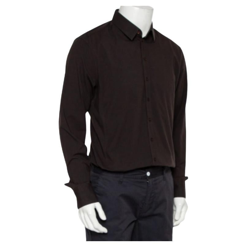 A classic brown fitted button-down shirt to highlight your best features, this shirt by Dolce & Gabbana is made from a cotton blend. It has a traditional collar, with front button closure and long cuffed sleeves. Add a touch of magic to your