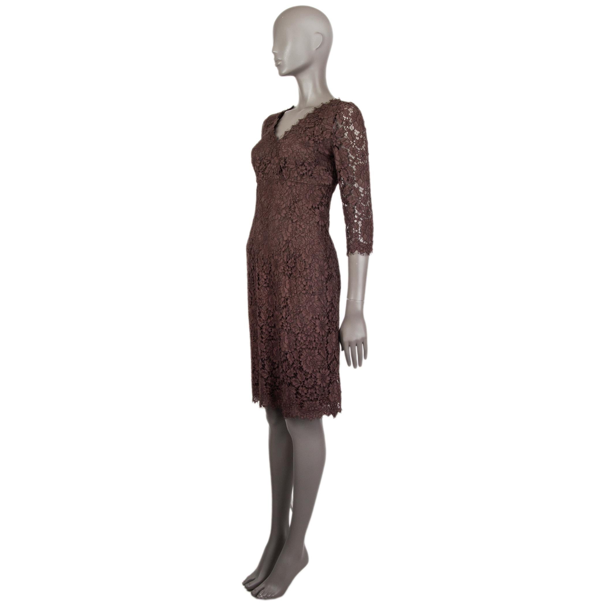 Dolve & Gabbana lace dress in brown cotton (79%), rayon (11%), and nylon (10%). With v neck and 3/4 sleeves. Closes with concealed zipper on the back. Lined in brown silk (85%), cotton (9%), elastane (4%), and nylon (2%). Has been worn and is in