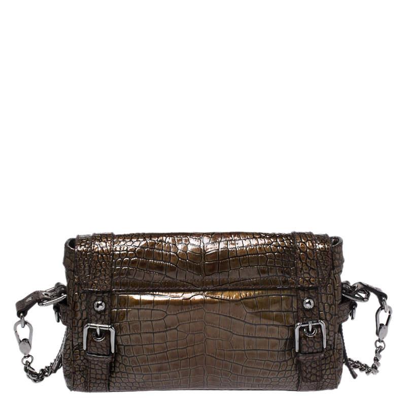 This chic Miss Easy Way bag by Dolce and Gabbana will enhance both your casual and evening wear. Crafted from croc embossed patent leather in brown, it is decorated with the brand plaque and a zip pocket on the front. The bag is equipped with a