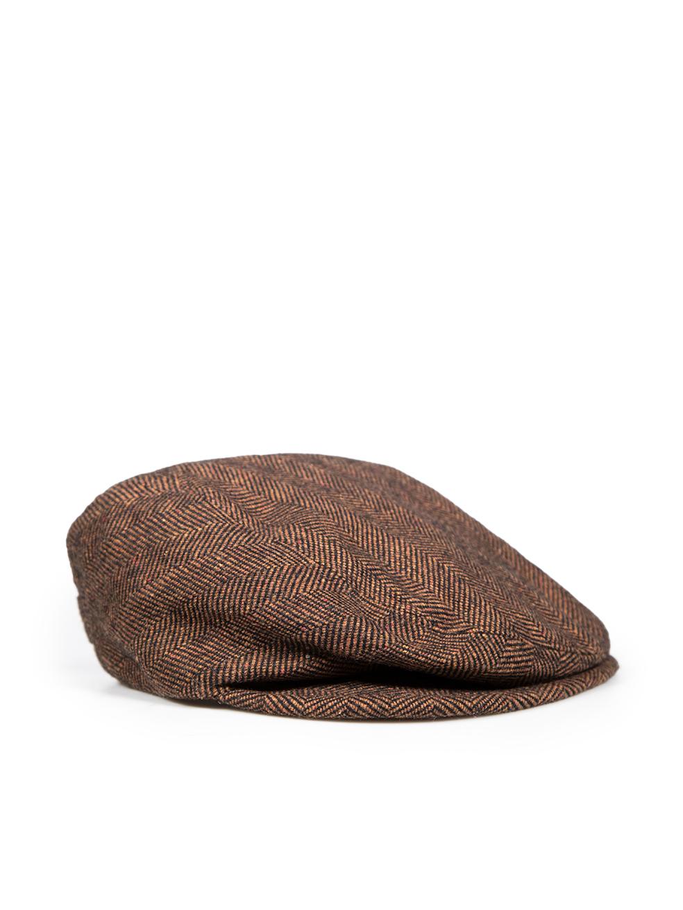CONDITION is Very good. Minimal wear to the hat is evident. Scratching to the designer logo detailing at the back. Discolouration on the inside rim at the front of this used Dolce & Gabbana designer resale item. Discolouration may need gentle hand