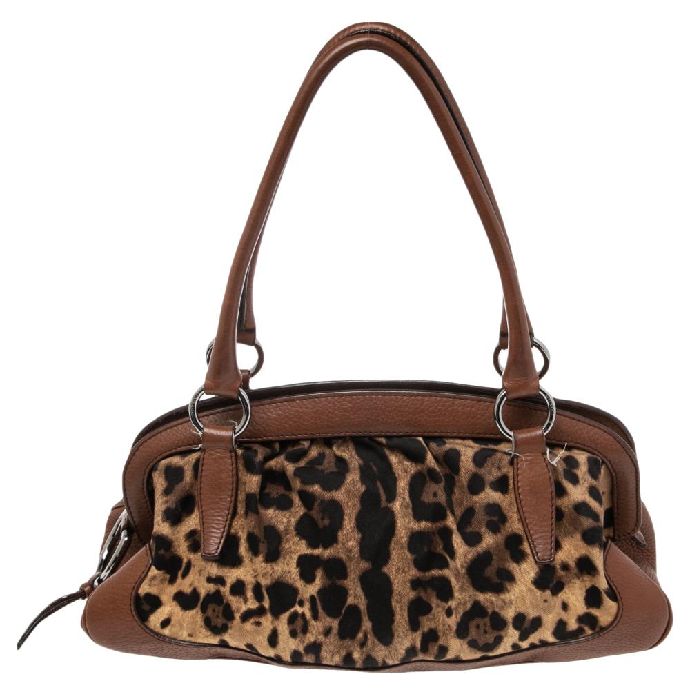 Do you know what would be the perfect bag to swing for your daily errands or sprees? This one here from Dolce & Gabbana. It is perfect! Crafted from leopard-print canvas as well as leather, the bag has a lovely shape, two leather handles, and a