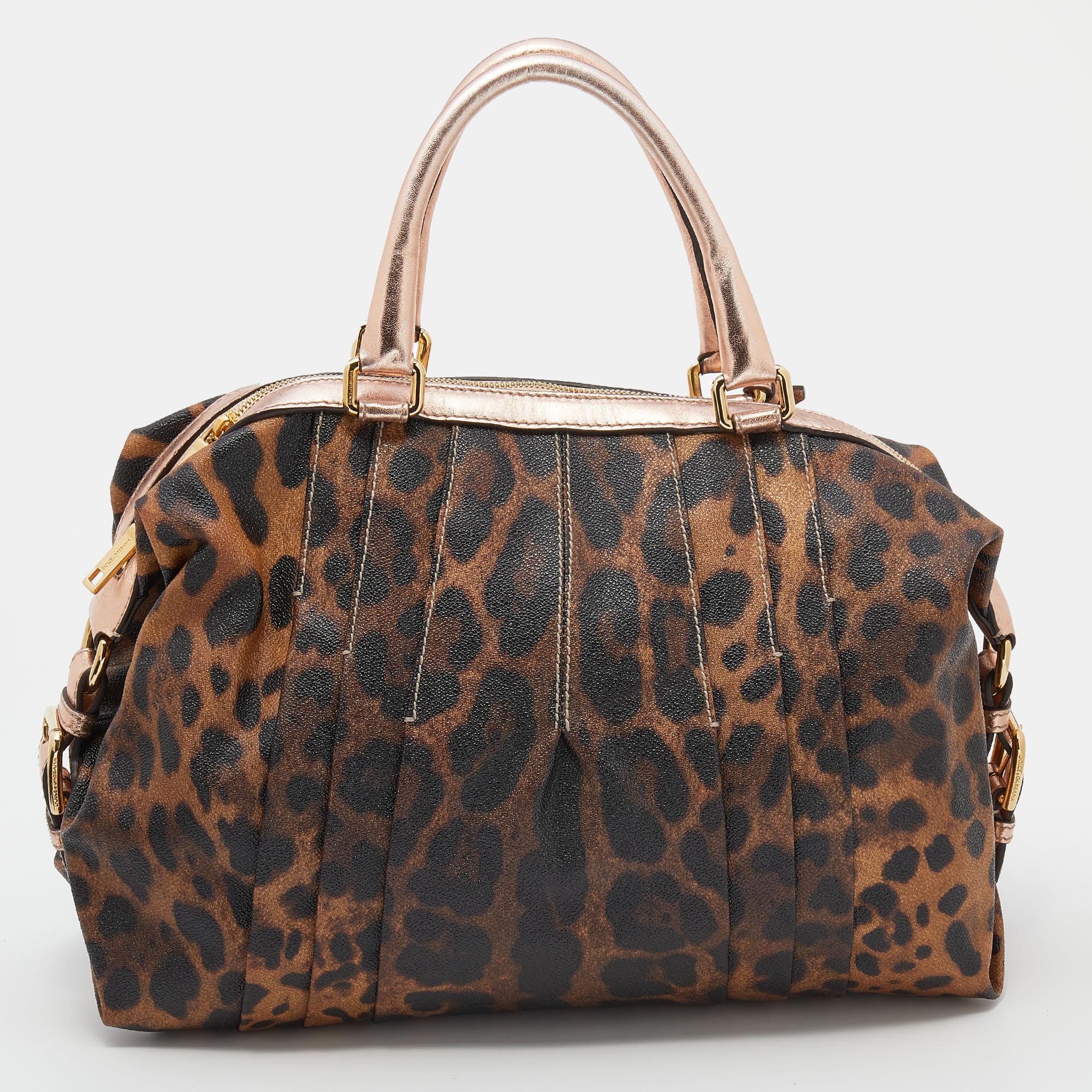 This satchel from Dolce & Gabbana is both elegant and functional. Crafted from brown-rose gold leopard printed canvas and leather, the bag features two top handles and gold-tone hardware. The canvas-lined interior has enough space to hold all your