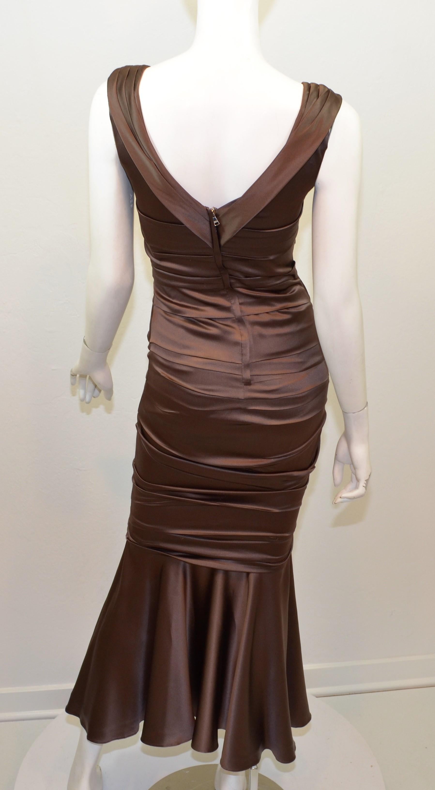 Dolce & Gabbana Brown Ruched Dress -- features a gathered design with a fluted hem. Dress has a back zipper closure and is fully lined.

Measurements:
Bust 33”, waist 26”, hips 32”, length 45”