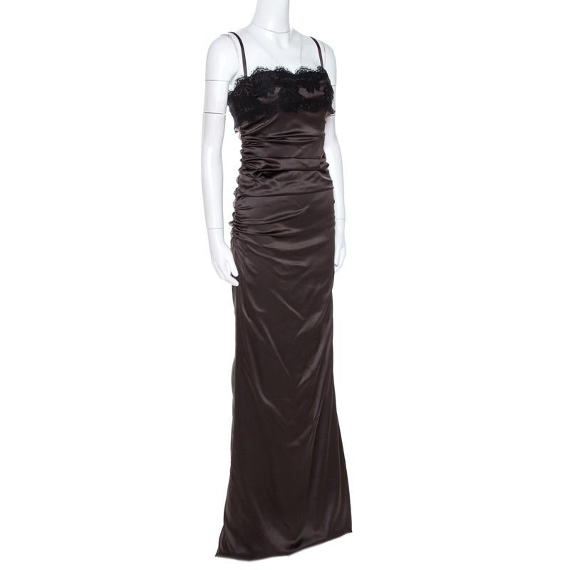 An exquisite fusion of class and grace, this Dolce & Gabbana dress will lend you endless style. This piece is nothing but classic fashion. Detailed with lace trims, the brown maxi dress has soft ruched details and zip closure.

Includes
The Luxury
