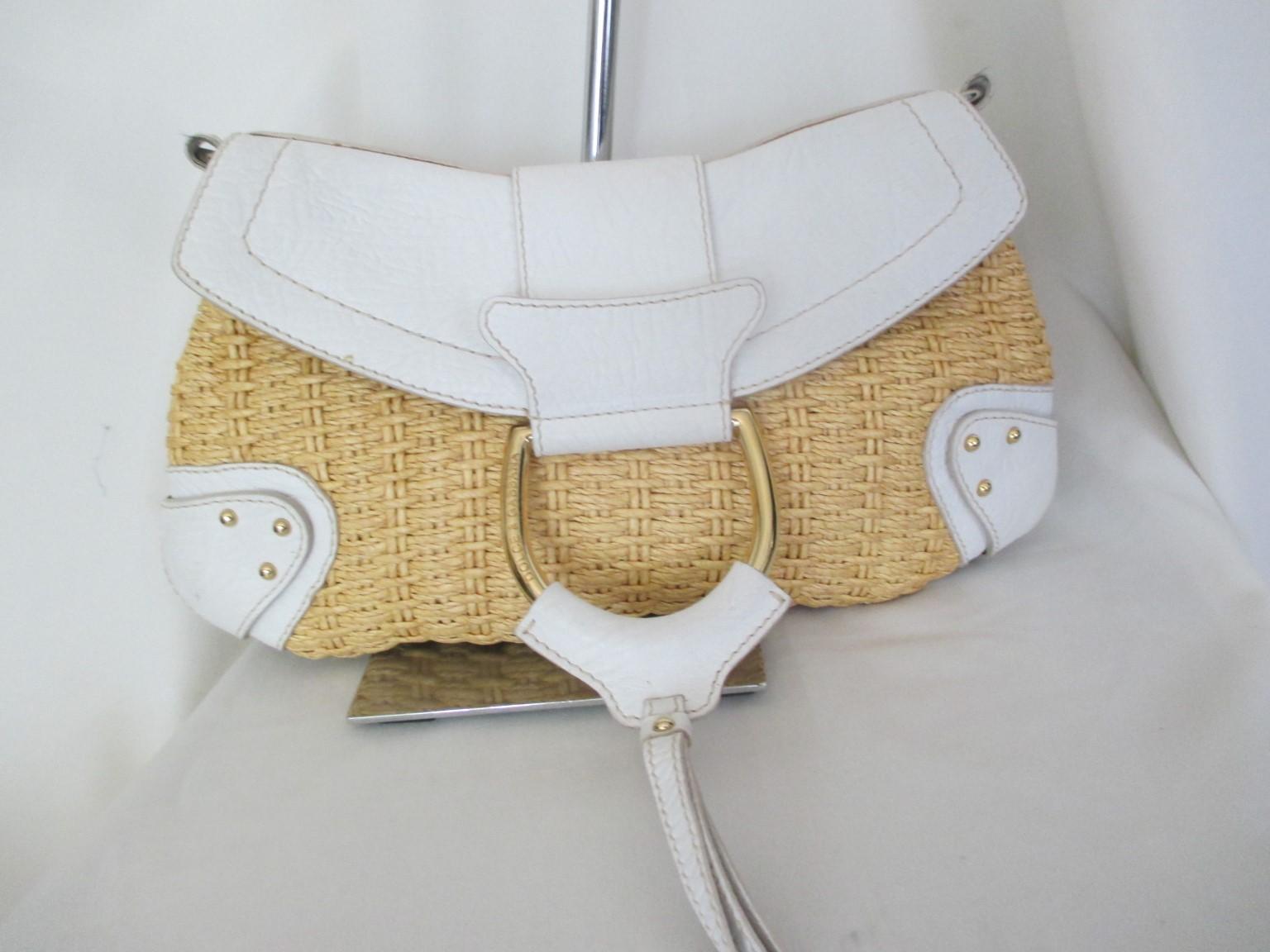 Dolce & Gabbana natural wicker white leather shoulder bag

We offer more exclusive vintage items, view our frontstore

Details:
The inside is the signature animal print fabric.  
There is one inside zipper pocket.
When opened you have the tan suede