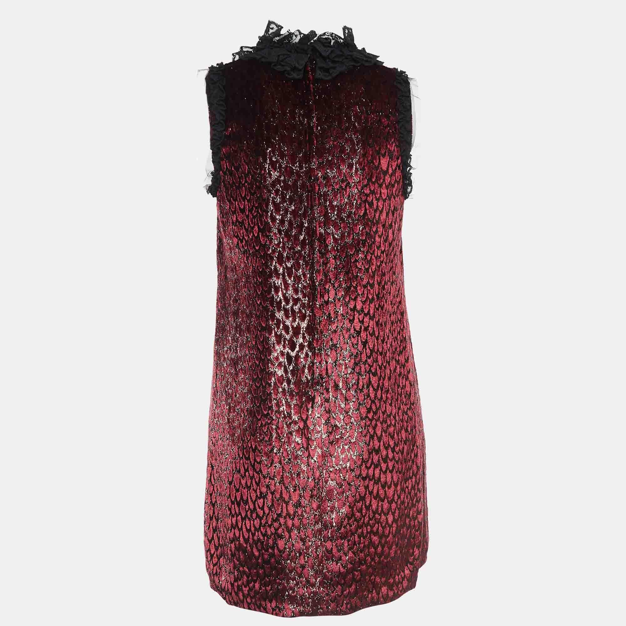 Masterful tailoring and timeless appeal characterize this dress from the house of Dolce and Gabbana. Presented in burgundy it is nothing but pure charm and is a must have.