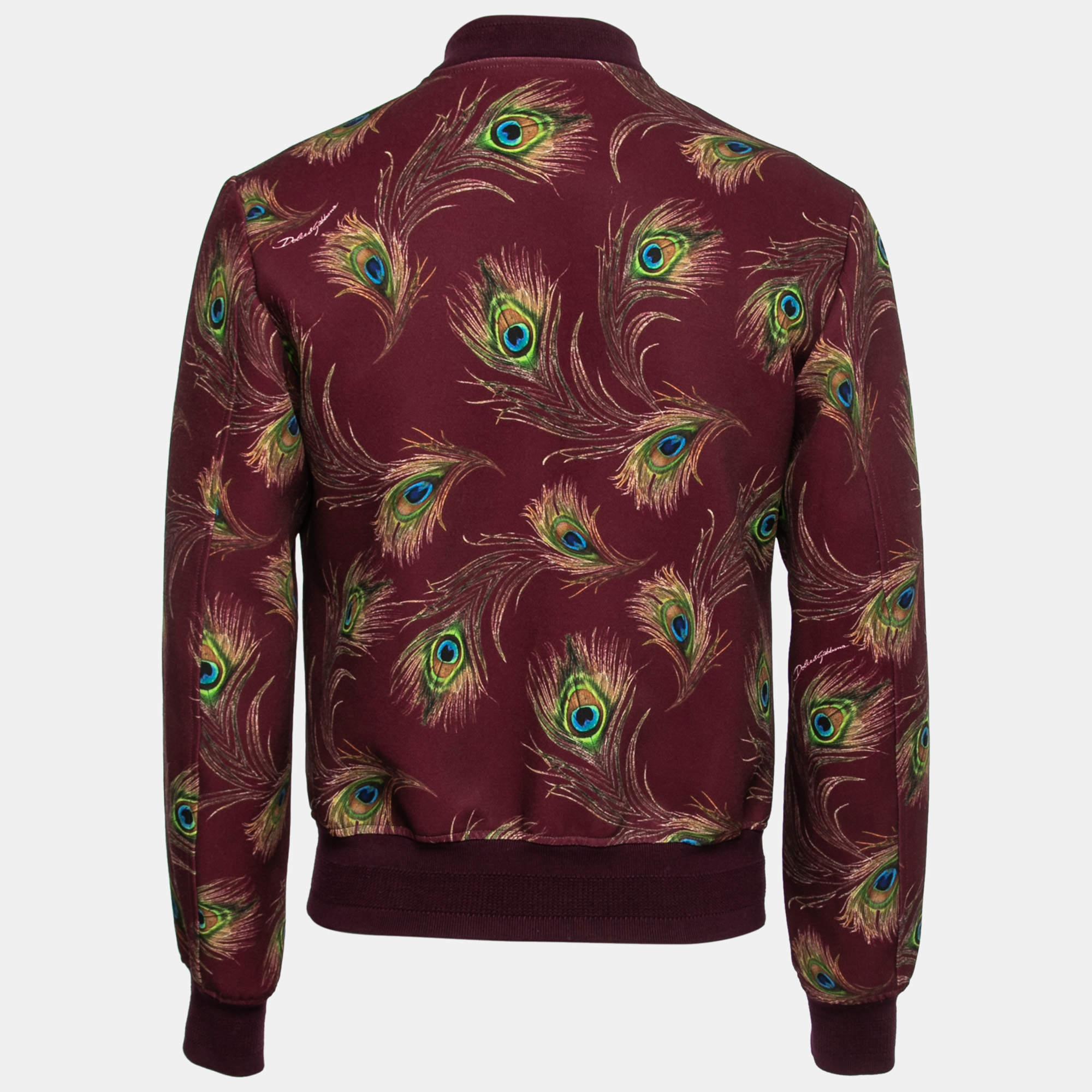 Stylish design, fine tailoring, and high quality come together in this bomber jacket from Dolce & Gabbana. Enhanced with a peacock feather print, this jacket for women is a 'casual style' must-have.

Includes: Brand Tag
