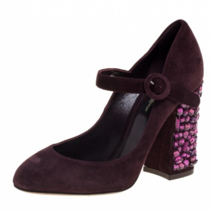 Lovely to look at and exuding feminine grace, these Mary Jane pumps from Dolce & Gabbana definitely need to be on your wishlist. The gorgeous burgundy pumps are crafted from suede and flaunt round toes, straps with buckle closures, leather insoles,