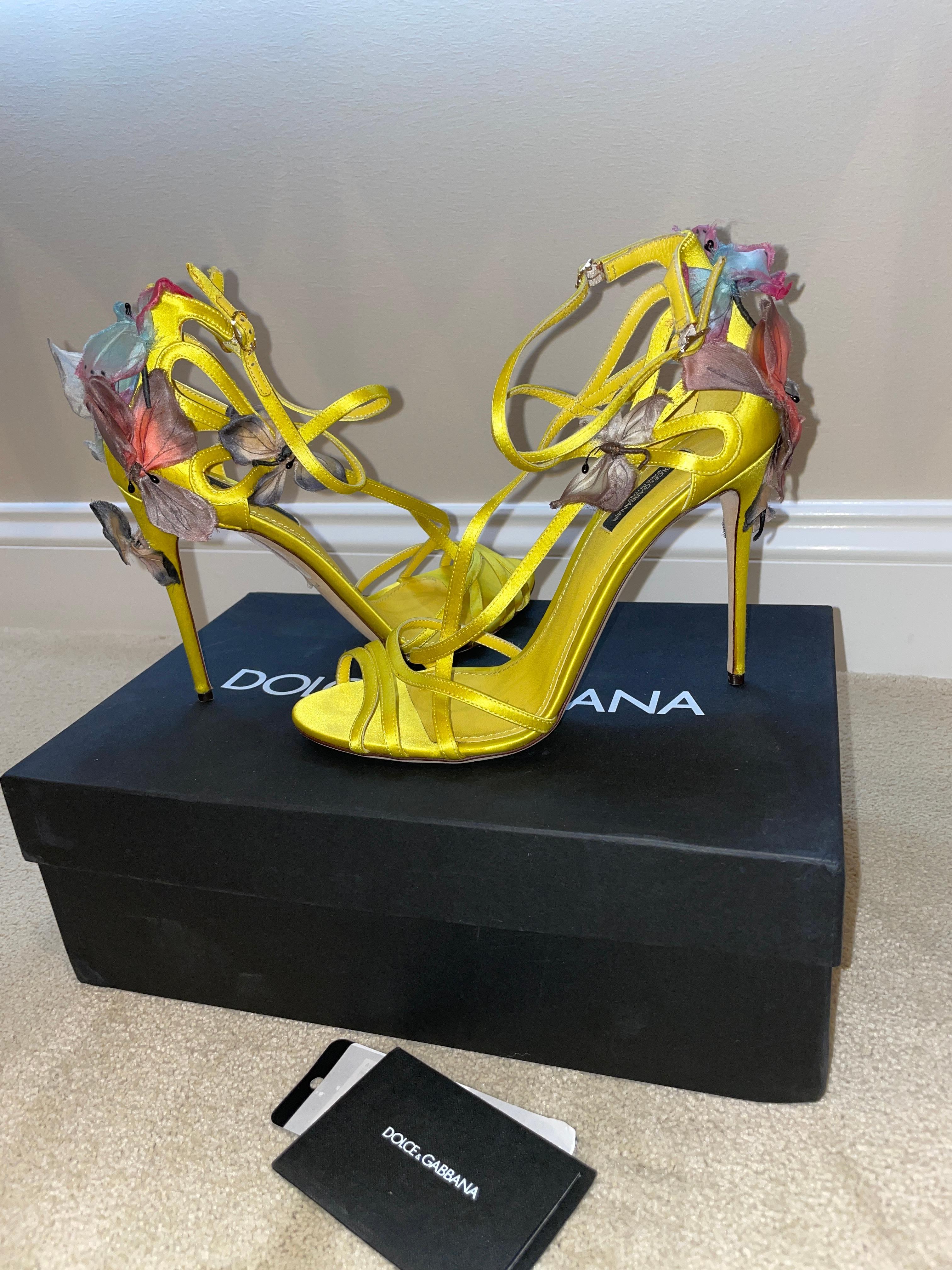 I believe to be vintage 1998 Dolce & Gabbana heels but not positive of the year. New in box. Size 39 yellow and strappy and FILLED with butterfly accents!
