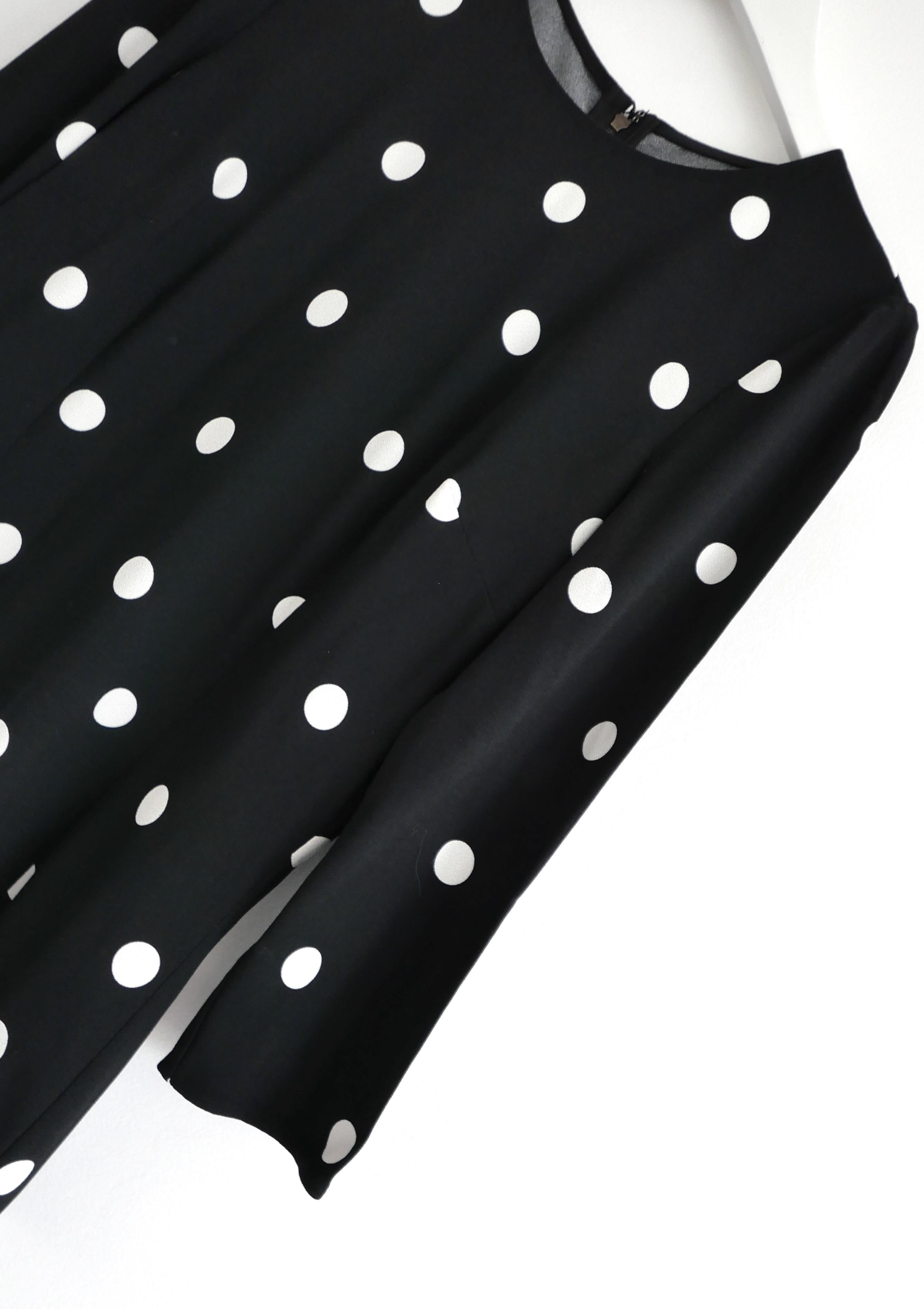 Classic chic Dolce & Gabbana polka dot top. Bought for £950 and new with tag. Made from super soft black and white viscose and elastane, it has a beautifully flattering tailored cut with round neck, bracelet length sleeves and concealed zip to back.