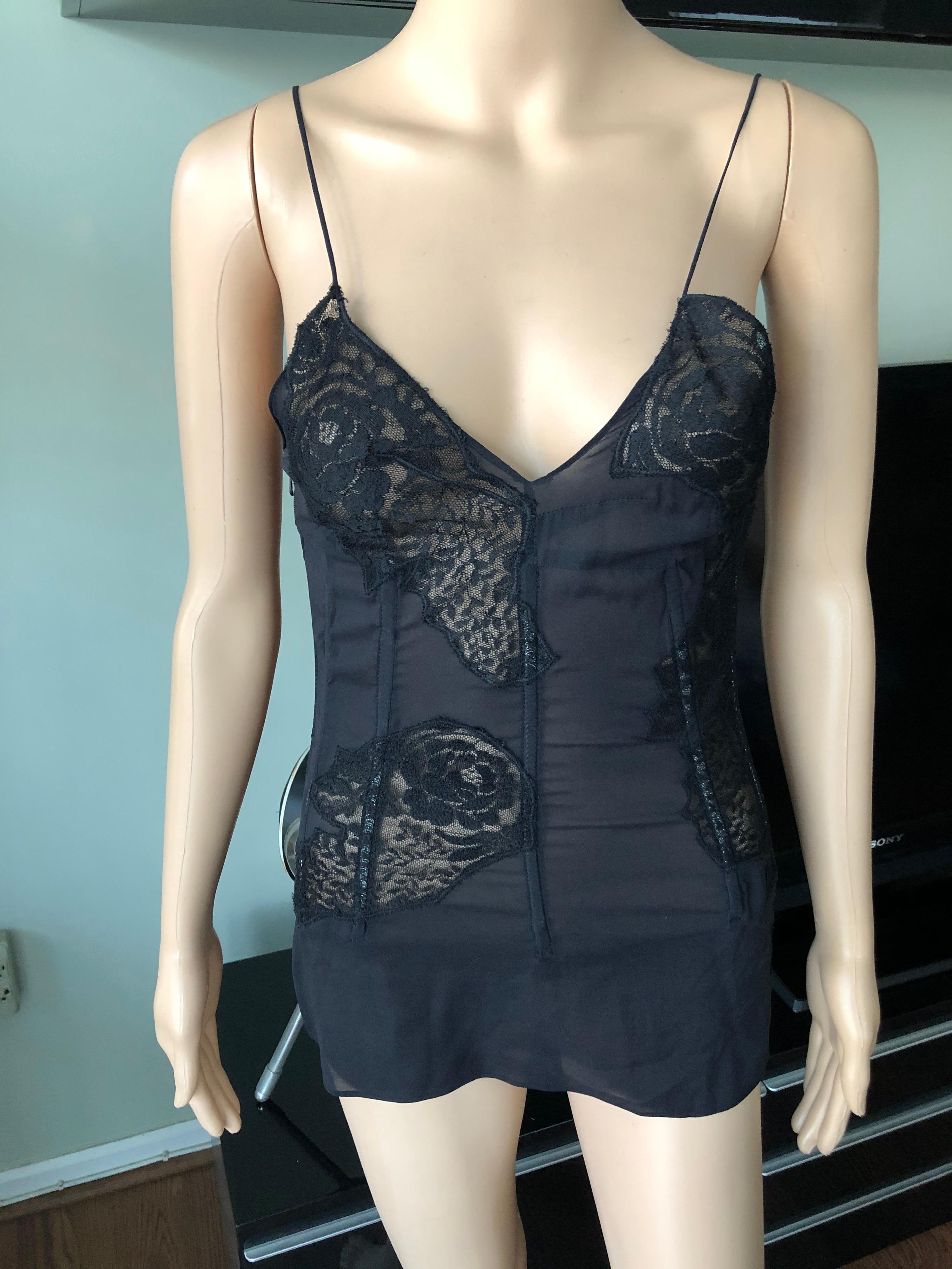 Dolce & Gabbana c. 2000 Sheer Silk and Lace Black Corset Top IT 42

Dolce & Gabbana silk top featuring lace panels throughout, V-neck, lace-up detail at back and zip closure at side.
