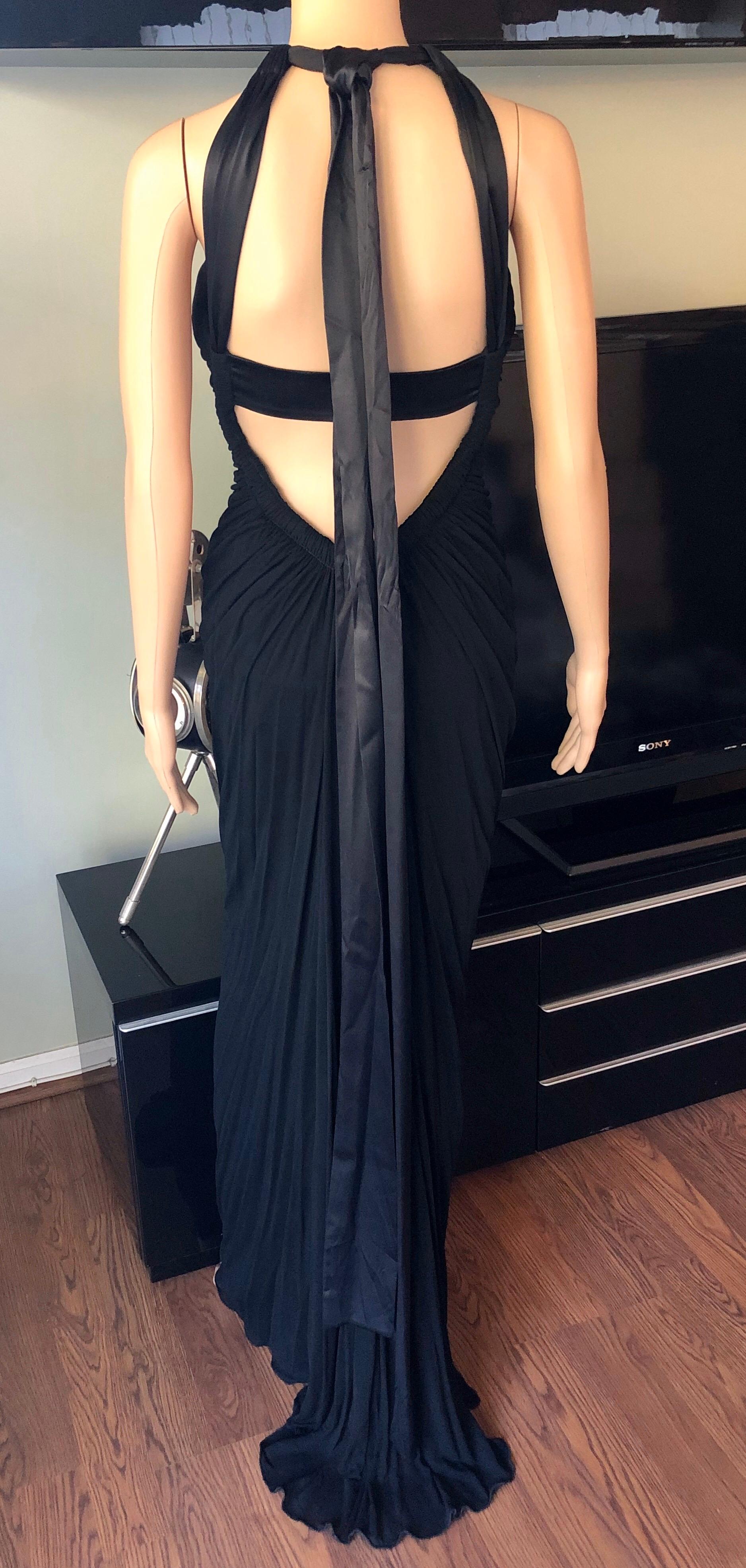 Dolce & Gabbana c.2000 Halter Cutout Open Back Black Evening Dress Gown IT 42

Dolce & Gabbana black evening gown with ruching details at bust and exposed cutout back featuring concealed zip closure and sash-tie closure at neck.
