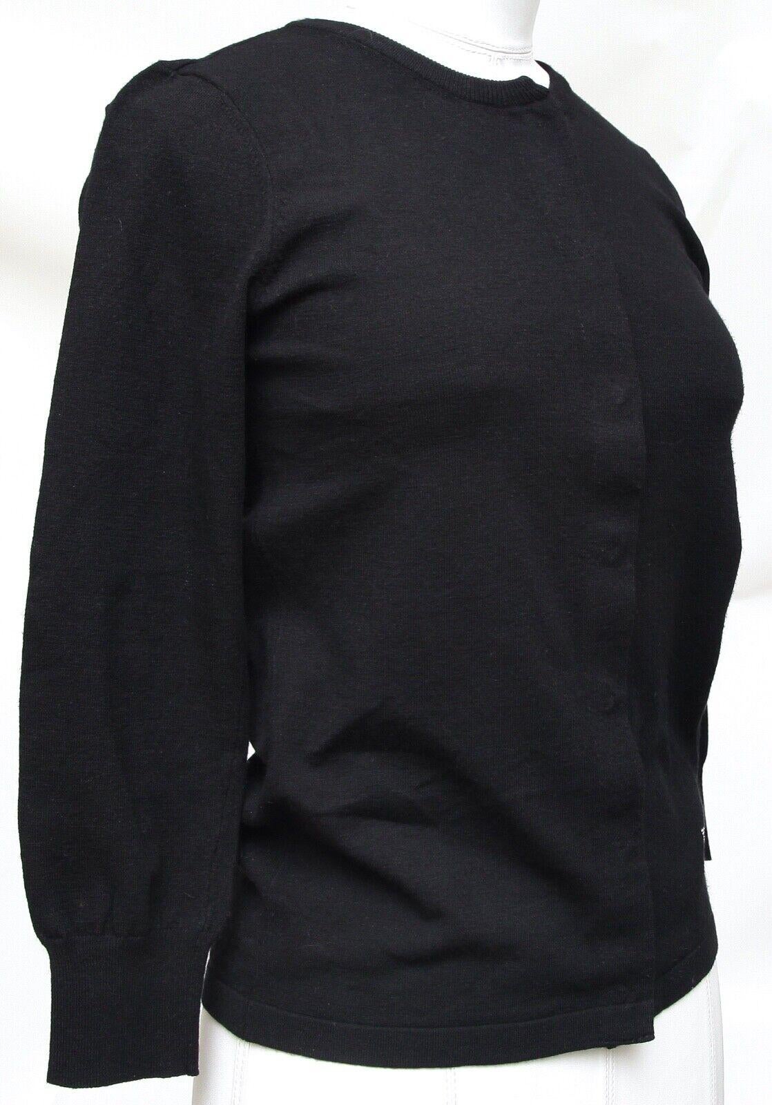 GUARANTEED AUTHENTIC DOLCE & GABBANA BLACK 3/4 SLEEVE SWEATER

Matching Sleeveless Sweater Available For Sale In A Separate Listing.

Details:
- Black 3/4 sleeve knit sweater.
- Scoop neck.
- Ribbing at hem and end of sleeve.
- DG logo in crystals