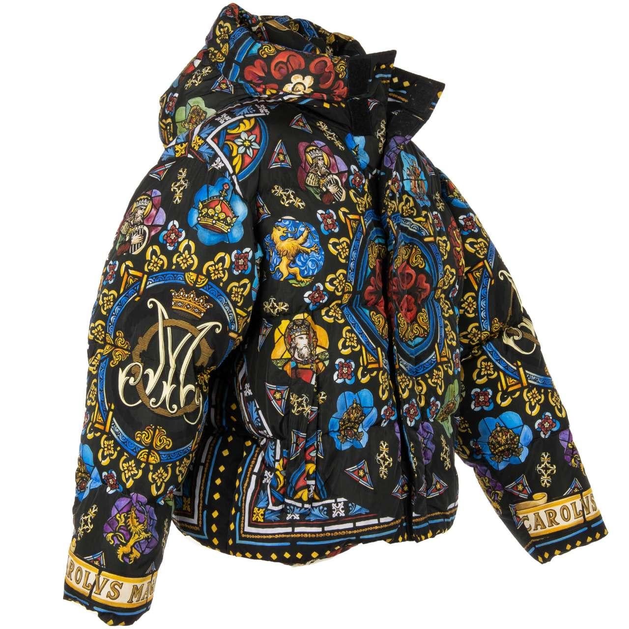 - Wide fit Carolus Magnus design printed bomber down jacket with hoody by DOLCE & GABBANA - New with tag - Wide Fit - fits 1-2 sizes bigger - MADE IN ITALY - Model: G9QX5T-HHMX6-HH82C - Material: 100% Nylon - Lining: 100% Polyester - Stuffing: 75%