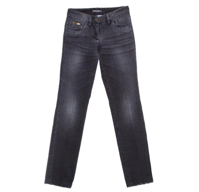 Now style all those tops of yours with these amazing charcoal grey faded effect jeans from Dolce and Gabbana. They are made of cotton and feature a straight fit silhouette. They flaunt a front button fastening, belt loops and a distressed