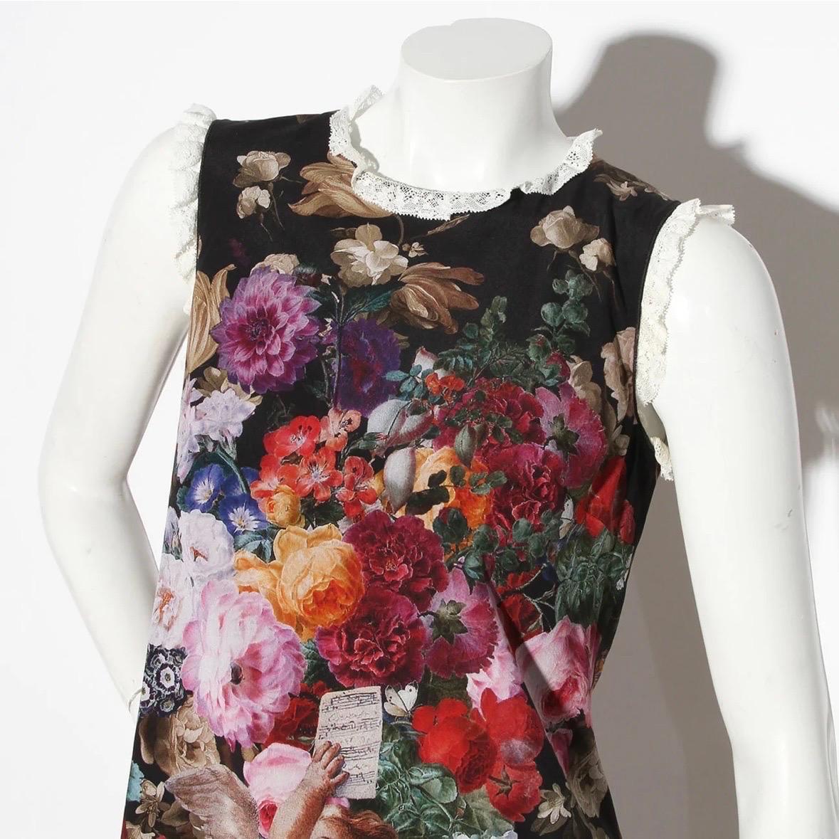 Dolce & Gabbana Shift Dress
Fall / Winter 2012 Ready-to-Wear
Made in Italy 
Renaissance cherub and rose print 
Multi color 
Lace ruffle detailing along neckline and shoulders 
Zipper down back of dress 
Fabric Composition: 94% Silk 6% Elastane