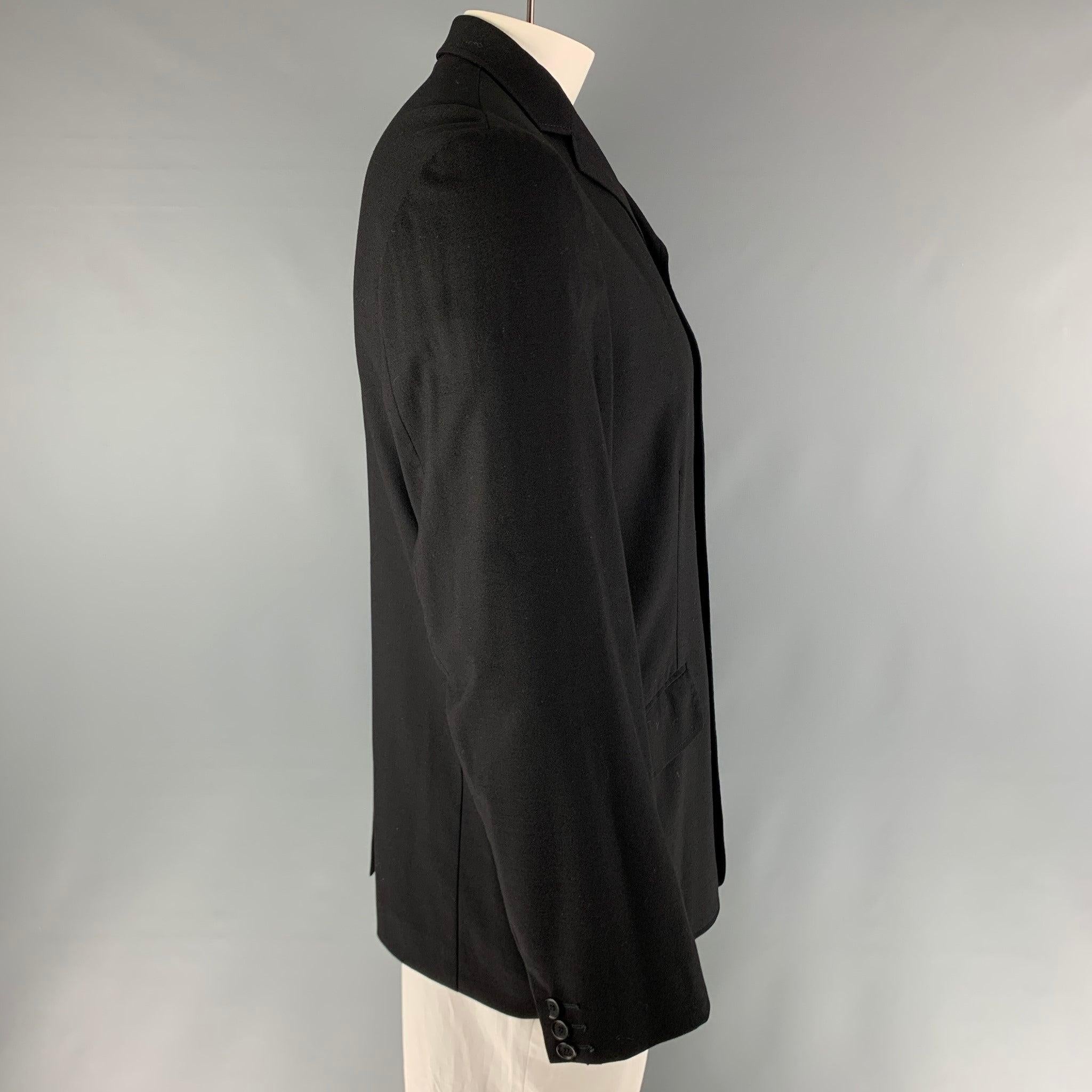 DOLCE & GABBANA black sport coat comes in a cashmere & lycra blend featuring a single breasted cut, flap pockets, and a notch lapel. Made in Italy.
Excellent Pre-Owned Condition. 

Marked:   40 

Measurements: 
 
Shoulder: 19 inches Chest: 45 inches