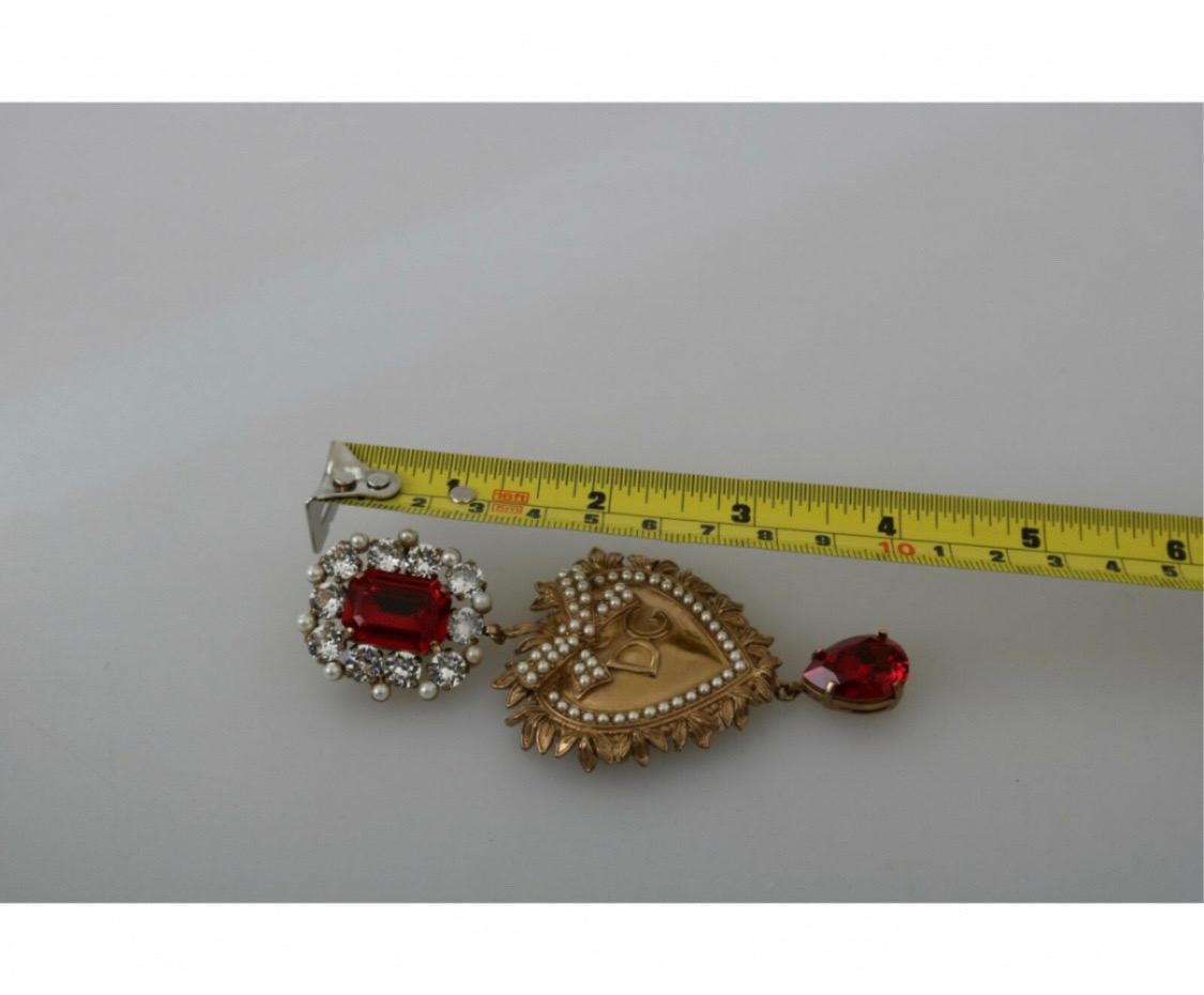 DOLCE & GABBANA
With tags, 100% genuine Dolce &
Gabbana earrings.
Pattern: Clip on Dangling
Pattern: Sacred Heart
Material: 80% brass, 20% glass
Color: gold
Crystals: red and clear
Logo details
Made in Italy
Length: 10 cm
Dolce & Gabbana Velvet Box,
