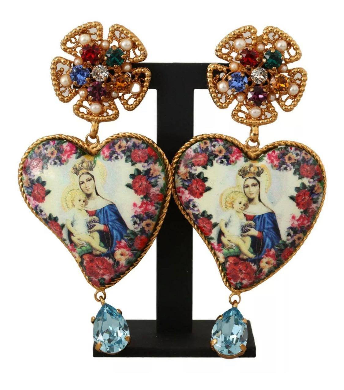 DOLCE & GABBANA

Gorgeous brand new with tags, 100% Authentic Dolce & Gabbana earrings.

Model: Clip-on, dangling
Motive: Sicily Heart Maria
Material: 40% Brass, 5% Plastic, 15% Glass, 40% Resin
Color: Gold with multicolor crystals
Logo details
Made