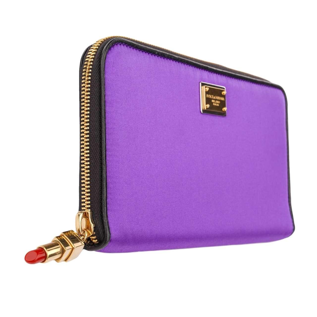 - Small Bag / Clutch with DG Logo Plate and metal red Lipstick Pendant in purple and gold by DOLCE & GABBANA - New with Tag - Material: 57% Viscose, 27% Silk, 16% Lambskin - Interior: one open pocket with Logo - Front flap with DG Plate Logo - Light