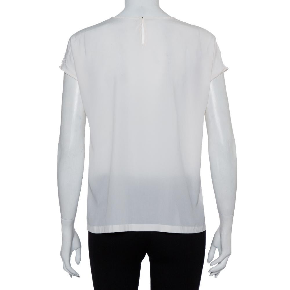 cream blouse with black trim