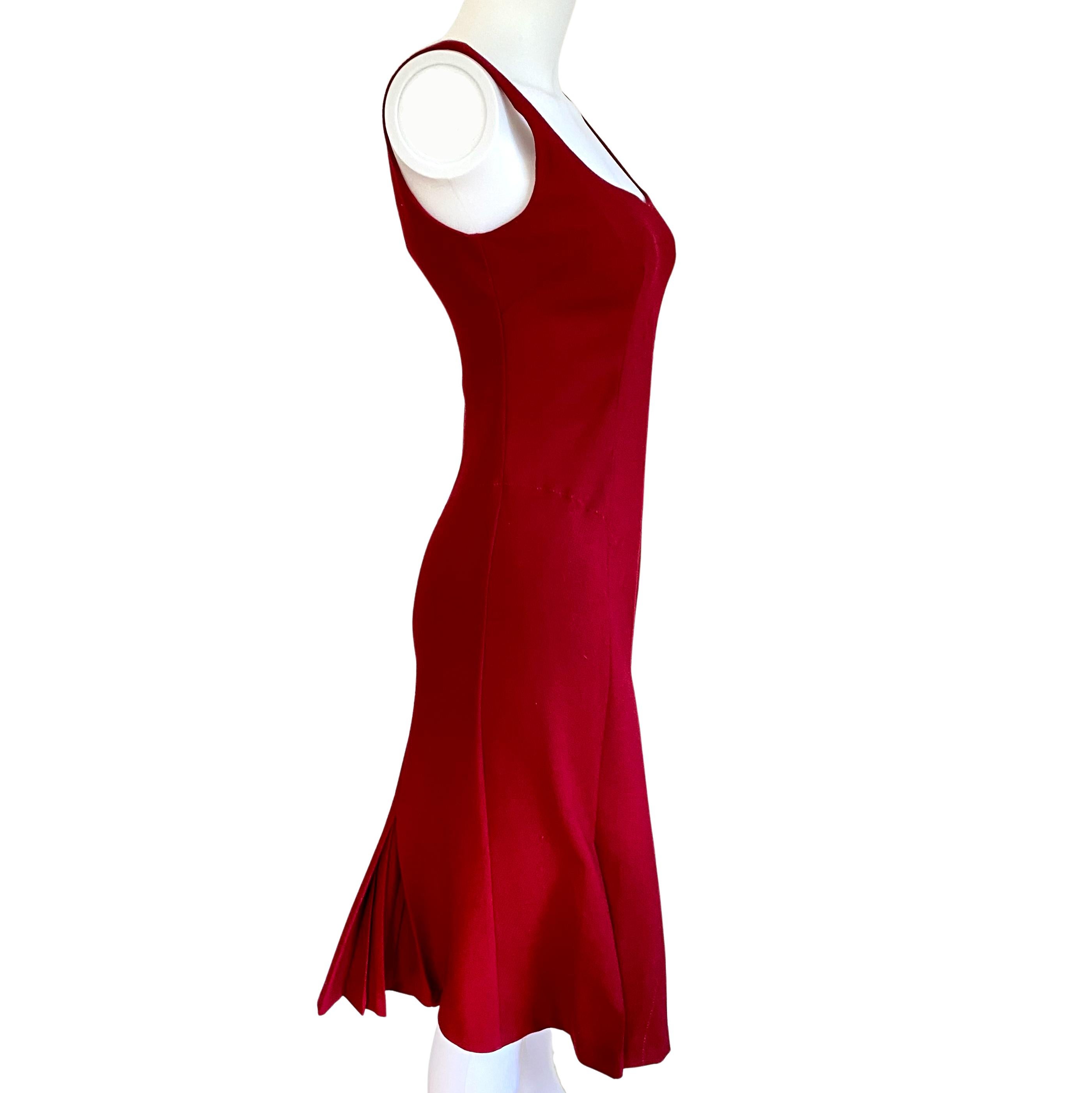 Classy and hot D&G deep crimson red Italian wool dress.
Tons of discrete, subdued Italian couture details:
Total of six sunburst pleats, couture stitching and tucks.
Invisible zipper + hook/eye at center back.
Gorgeous deep crimson red.
38% pure