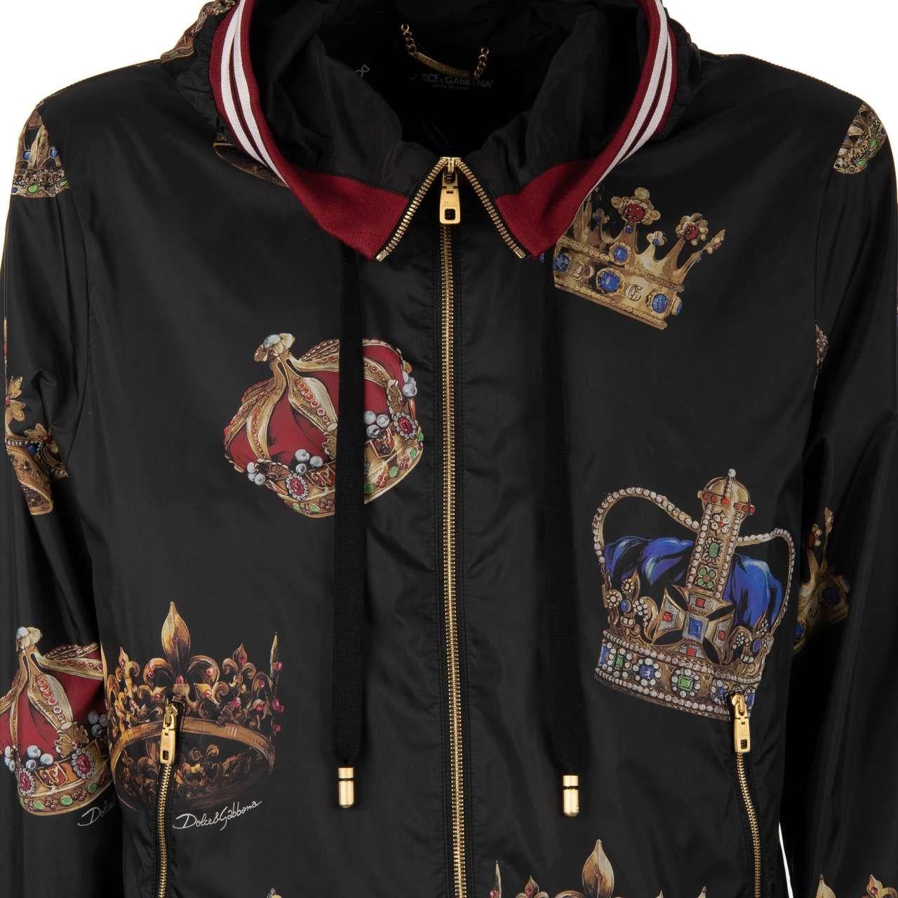 - Crowns and logo printed bomber jacket with zip pockets, hoody and knit details by DOLCE & GABBANA - New with tag - Regular Fit - MADE IN ITALY - Model: G9LG8T-HSMVN-HNV93 - Material: 100% Nylon - Lining: 100% Polyester - Knit: 96% Silk, 4%