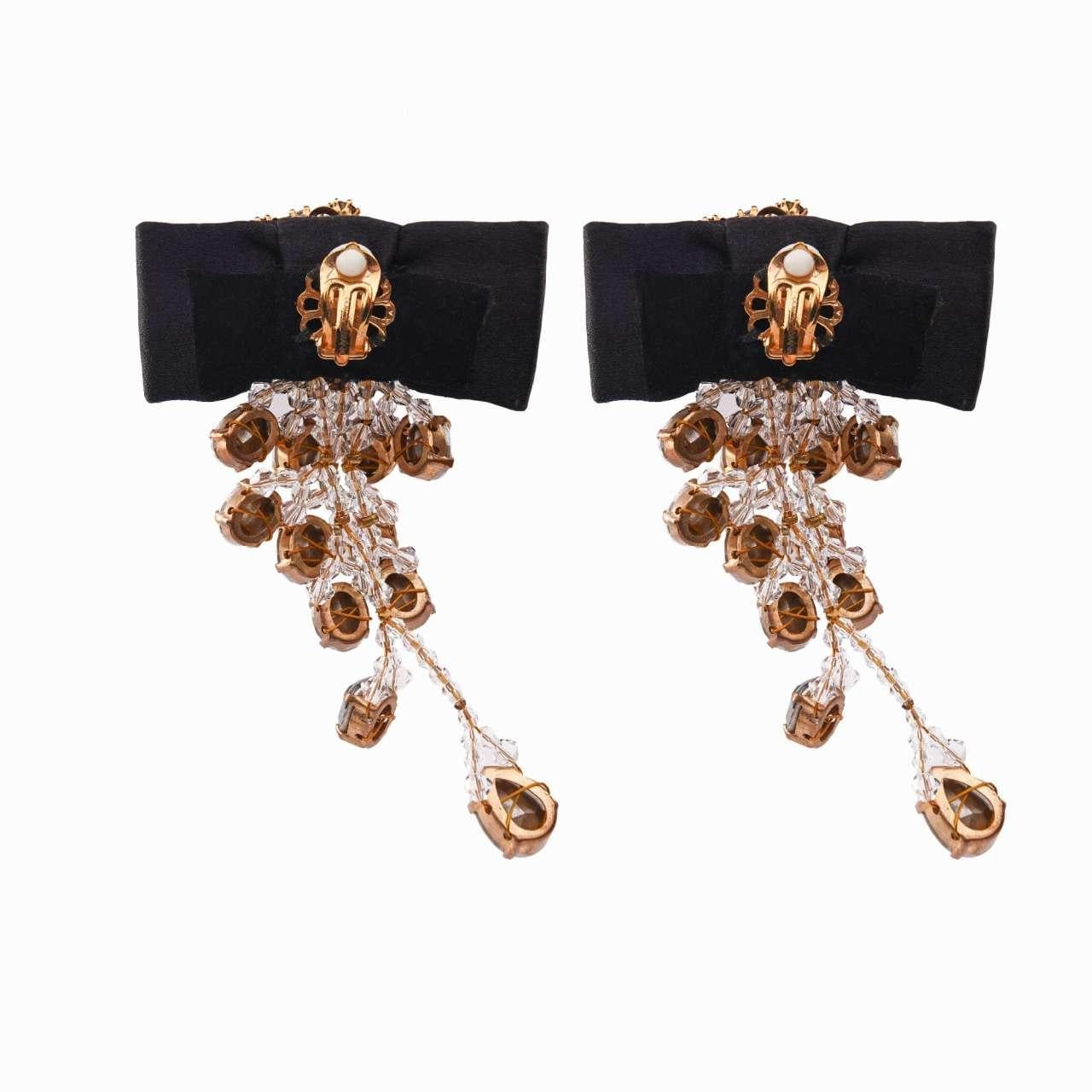 - Chandelier Clip Earrings adorned with silk bows, filigree elements and crystals in black and gold by DOLCE & GABBANA - RUNWAY - Dolce & Gabbana Fashion Show - New with Tag - Made in Italy - Gold-plated brass - Clip fastening - Nickel free - Model: