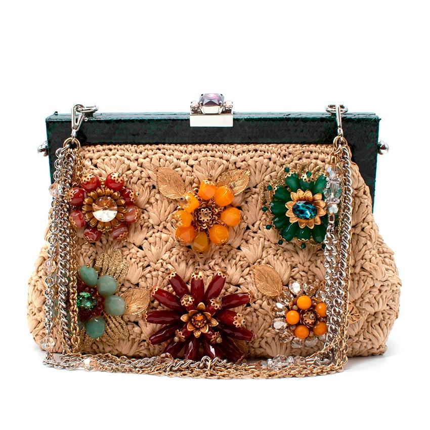 Dolce & Gabbana Crystal-Embellished Raffia Snakeskin Frame Bag
 

 - Unusual fusion of flexible knitted raffia, embellished with multicolour glass crystals, and a dark green snakeskin frame 
 - Snap top clasp, with large purple crystal decoration
 -