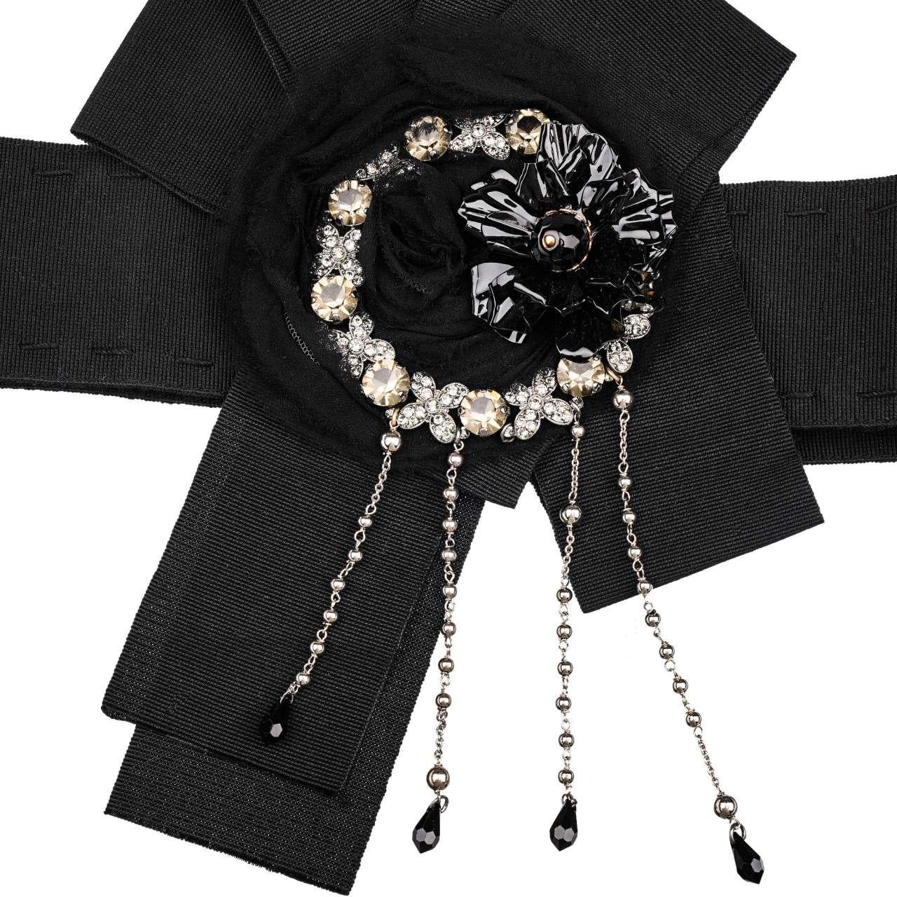 - Belt for dress with crystal and brass flower brooches, chains and silk applications in black by DOLCE & GABBANA - New with Tag - MADE IN ITALY - Modell: FB250Z-GDF69-N0000 - Material: 60% Cotton, 40% Acetat - Width: 6 cm - Push buttons Closure -