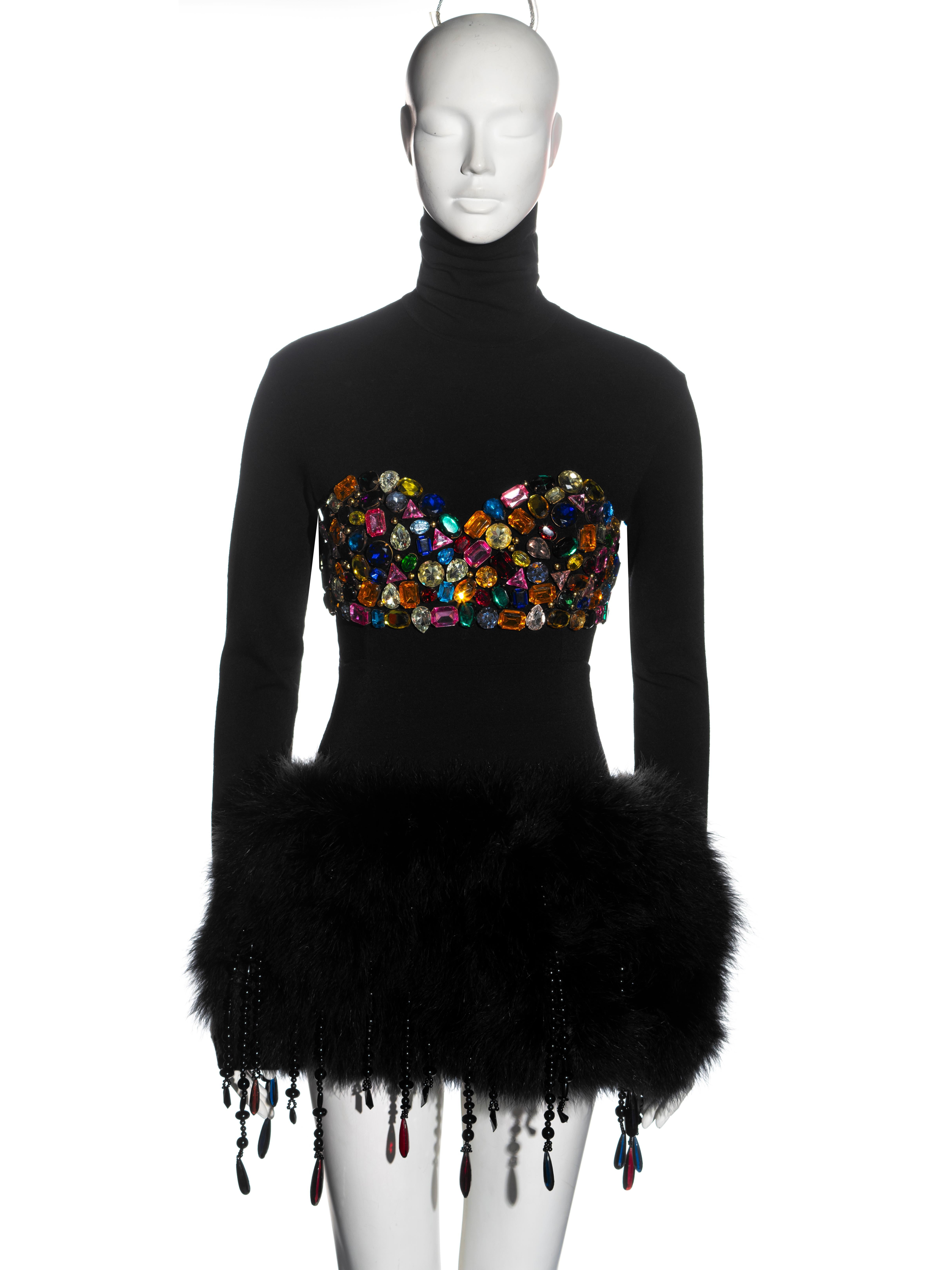 ▪ Dolce & Gabbana top and skirt set 
▪ Turtleneck top with large multicoloured crystal embellishments in a shape of a bra
▪ Marabou feather puffball mini skirt with beaded tassel trim 
▪ IT 42 - FR 38 - UK 10 - US 6
▪ Fall-Winter 1991
▪ Made in