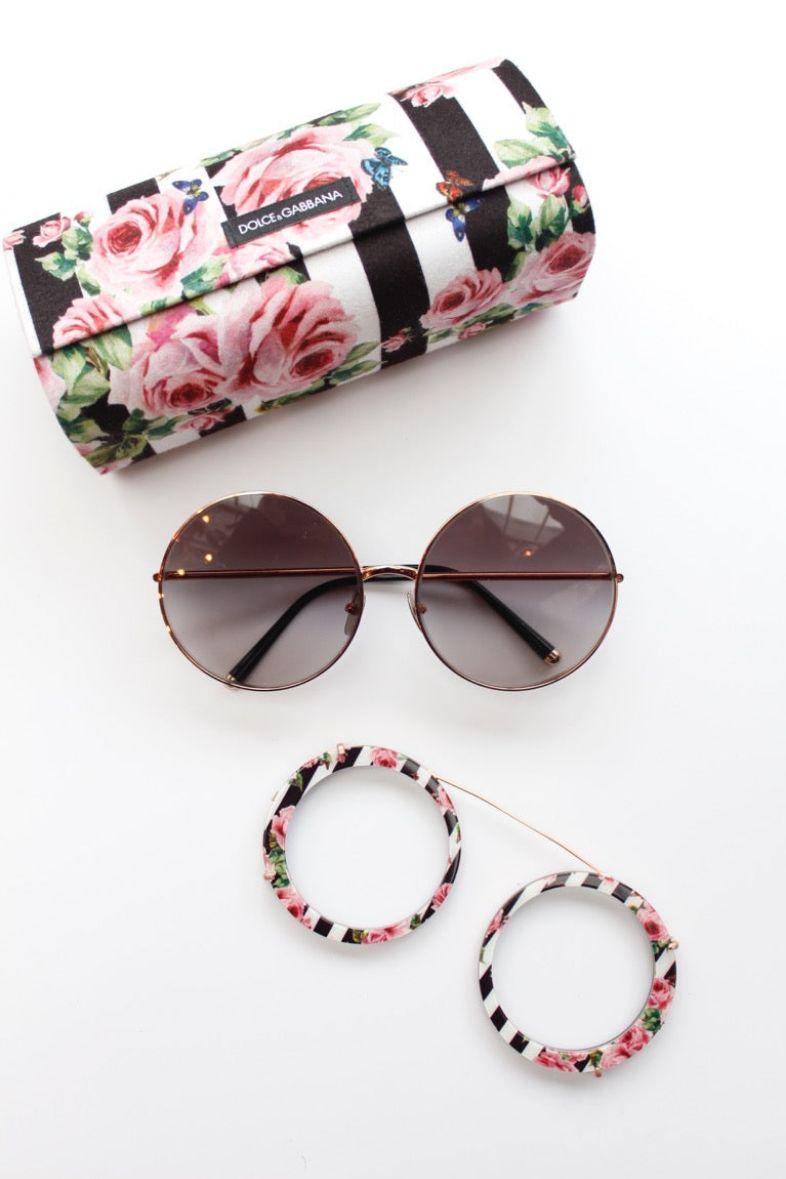 Dolce & Gabbana (Made in Italy) Customizable sunglasses. The frame is rather thin but can be doubled by a removable second frame. 
The additional frame has two different prints, black and white with roses on one side, glossy black on the other side.