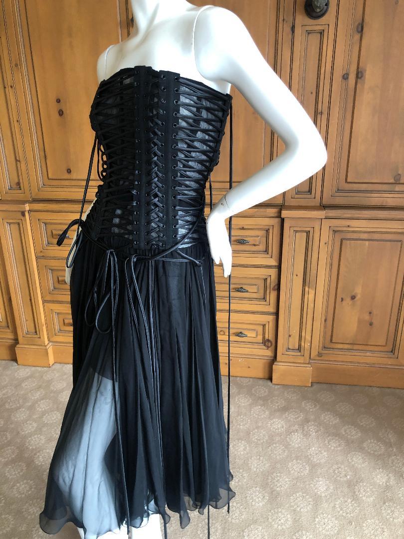 Dolce & Gabbana Amazing Lace Up Corset Black Dress 
New with Tags $3295 
 So pretty, there is an inner corset, and a lot of stretch
Size 44
 Bust 34