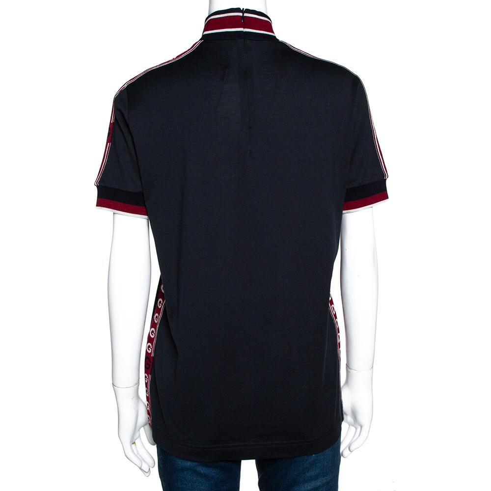 Dolce & Gabbana's shirt is impeccably tailored and cut from super-soft cotton and features logo tape details. Designed for a relaxed fit, this dark blue shirt has short sleeves. Balance the style with trousers or skirts.

