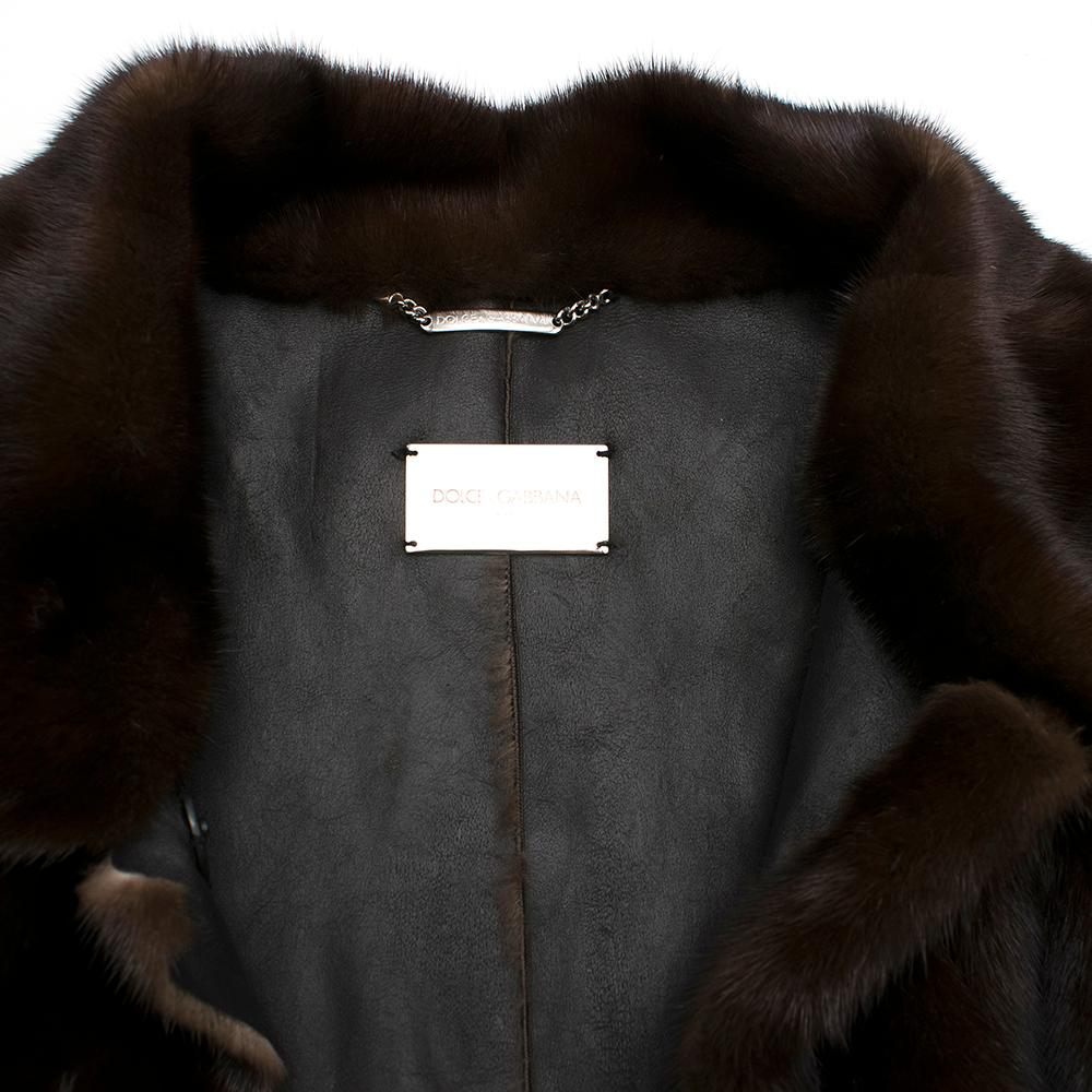 Dolce & Gabbana dark brown coat featuring long sleeves, front patch pockets with fringes, concealed front button fastening and spread collar. 

Composition:
- 100% mink
Care:
- No wash in water
- no dry cleaning

- Made in Italy

Please note, these