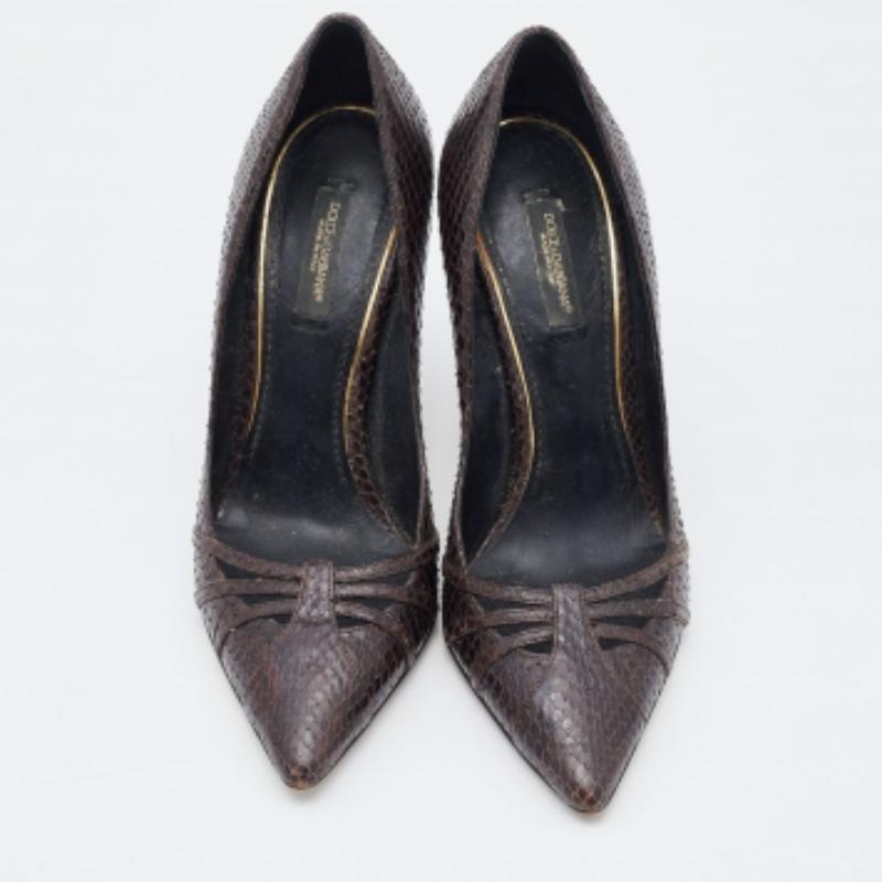 Upgrade your look by adding these Dolce & Gabbana dark brown pumps to the wardrobe. They are crafted from python leather and designed with pointed toes and stiletto heels.