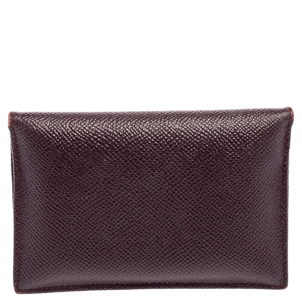 This stylish and functional card case by Dolce & Gabbana is a must-have. Crafted from leather, it has a lovely dark burgundy shade, a gold-tone brand plaque on the front, and a secure interior that is equipped to neatly hold your cards.

Includes: