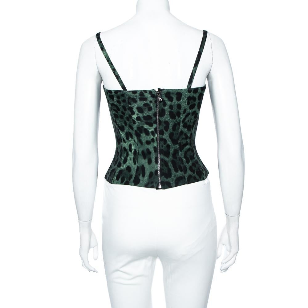 This classy top from Dolce & Gabbana with a beautiful design and a stylish strappy silhouette is a must-have. Masterfully tailored in pure silk, this dark green leopard-printed bustier top will make a very exquisite addition to any woman's