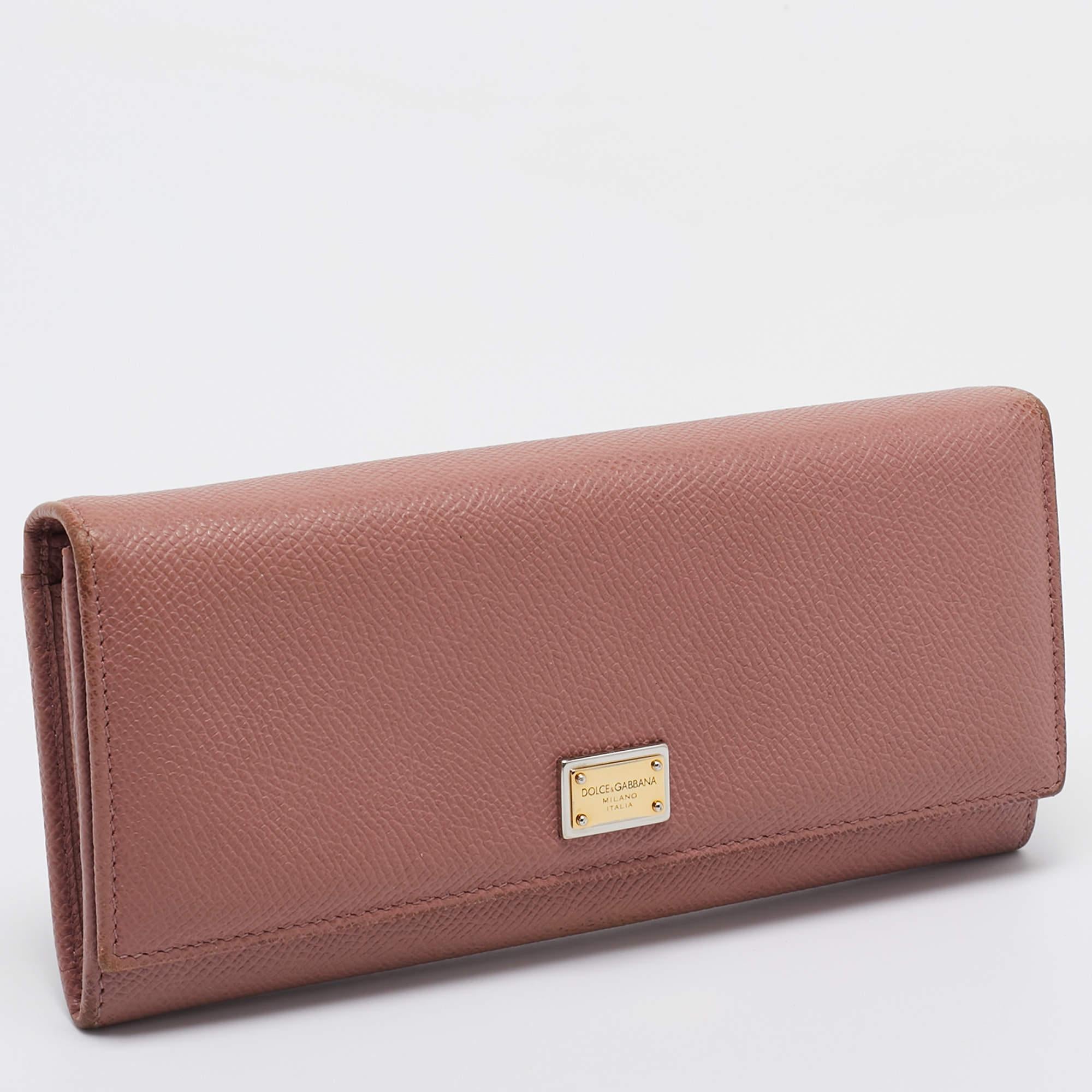 A beautiful wallet for everyday use this Dolce and Gabbana wallet is perfect to be carried solo or inside your tote while you step out to run errands. It is a durable accessory.