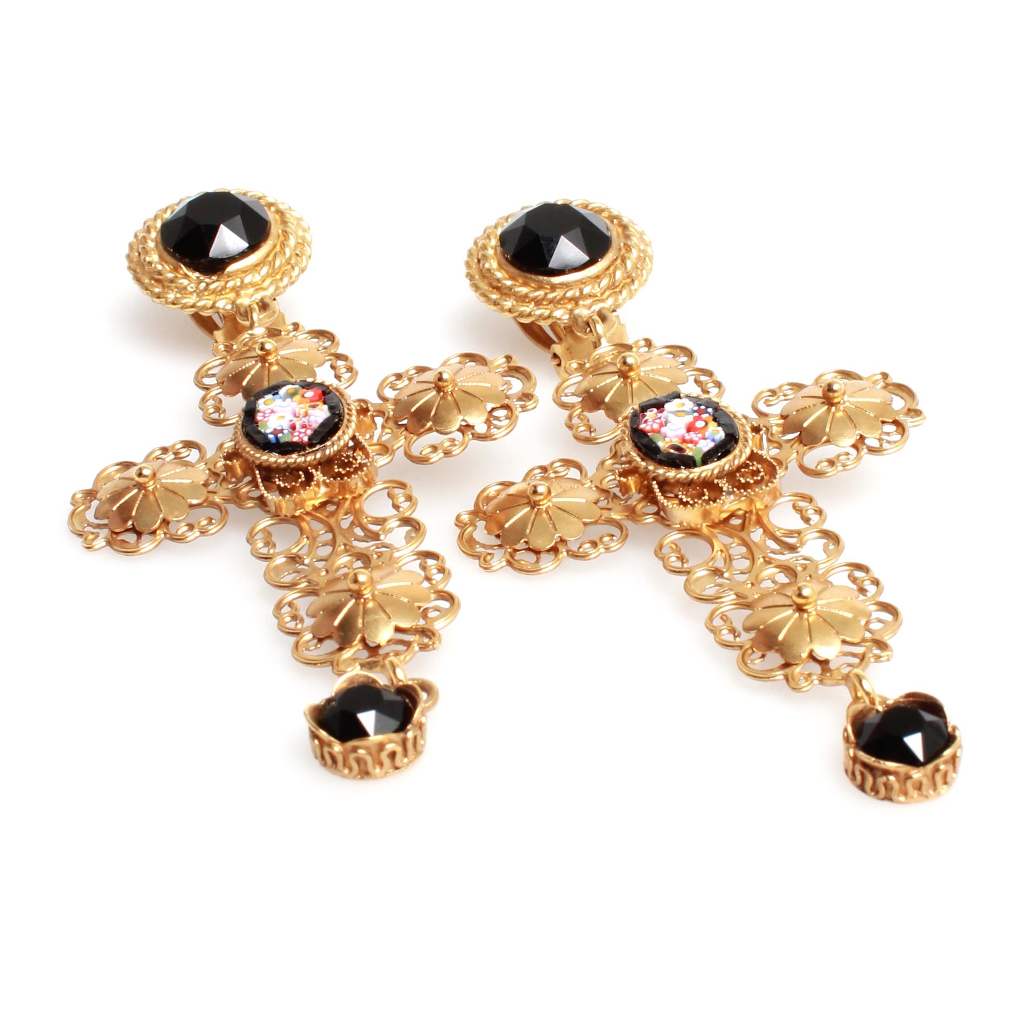 Heavenly gold toned Dolce and Gabbana cameo cross clip on earrings featuring black cut glass detailing and floral cameo center. Super light weight!
