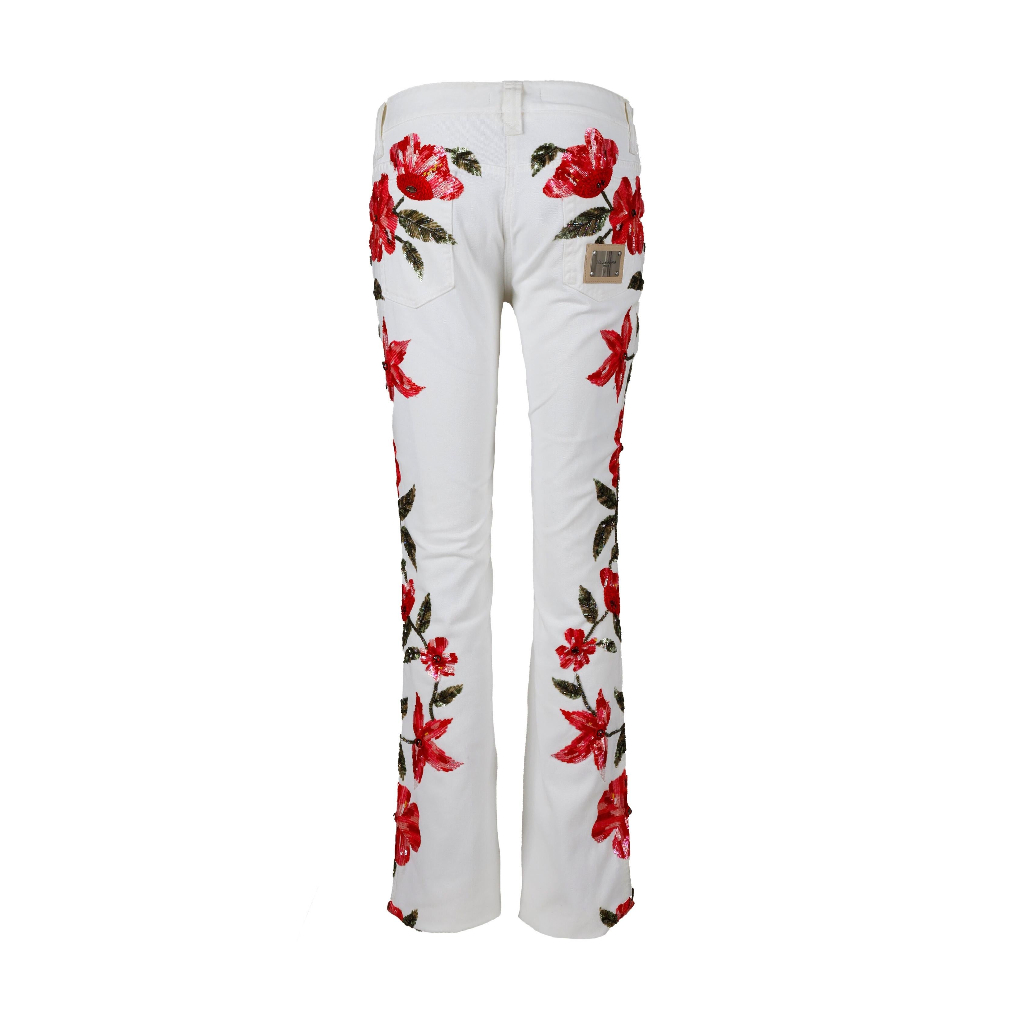 These Dolce & Gabbana Embellished Floral Pants make a chic statement with all-over flower designs with sequin, beads and rhinestones in red and green. Features include mid rise fit, embossed logo buttons and patch behind the back pocket that adds a