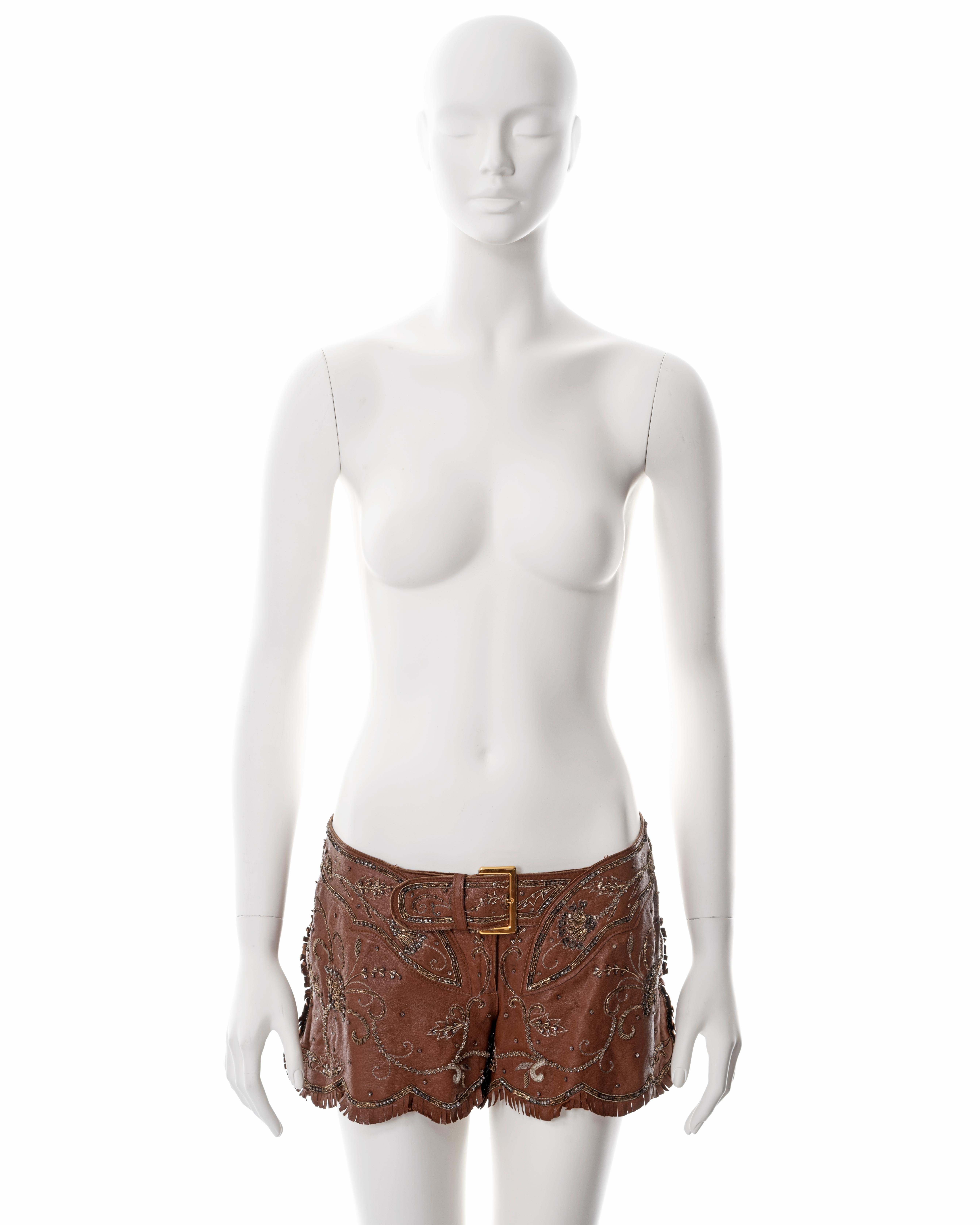 ▪ Dolce & Gabbana brown goat leather hot pants 
▪ Sold by One of a Kind Archive
▪ Spring-Summer 2001
▪ Gold-tone metal buckles 
▪ Metal thread embroidery 
▪ Fringe trim 
▪ Zippers on  side seams 
▪ IT 42 - FR 38 - UK 10 
▪ Made in Italy

All