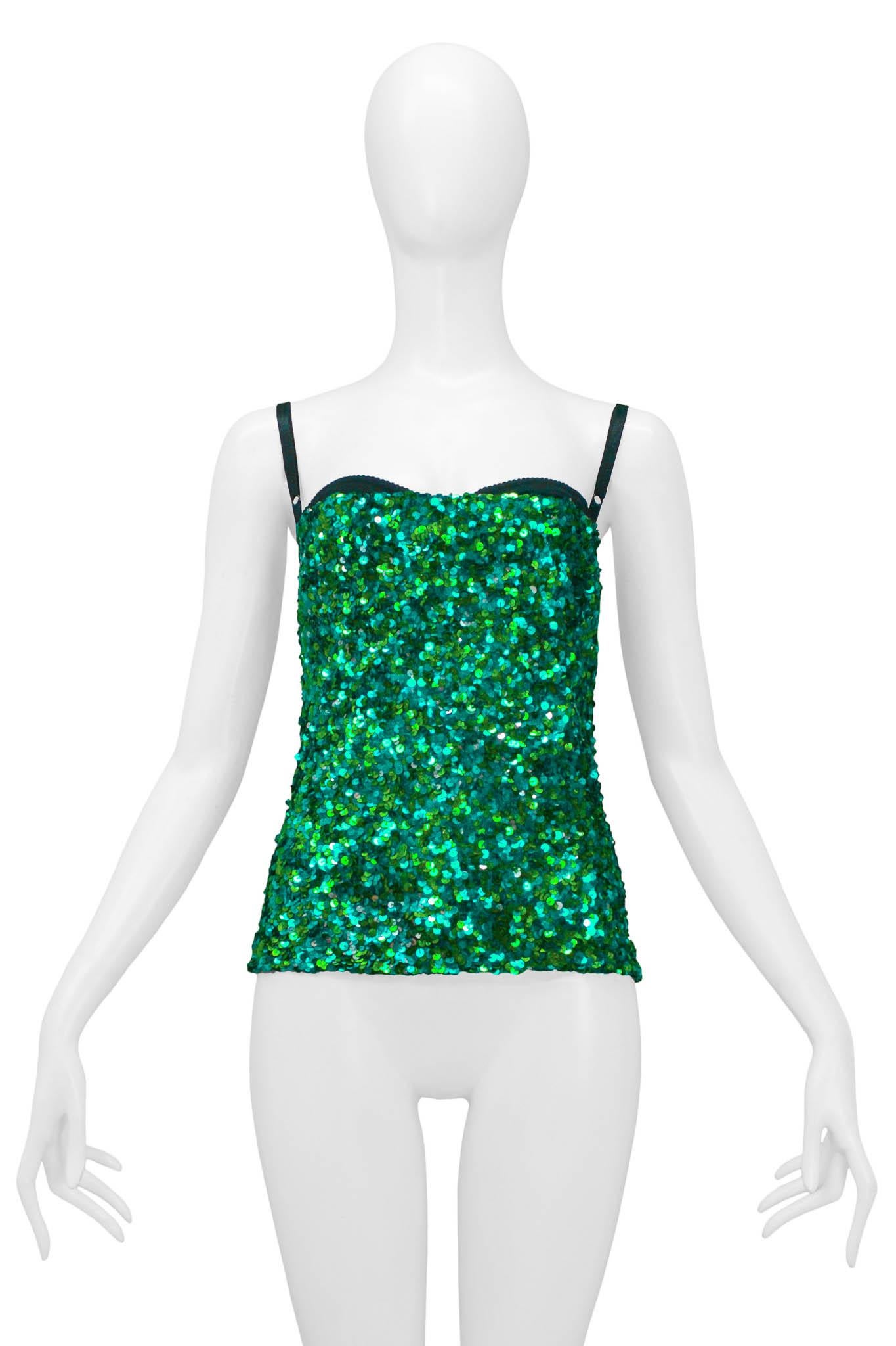 Resurrection Vintage is excited to present a vintage Dolce and Gabbana emerald green sequin corset top featuring exposed bra detail, black adjustable straps, and center back zipper closure. 

Dolce & Gabbana
Size: 40
Sequins, Poly
Excellent Vintage