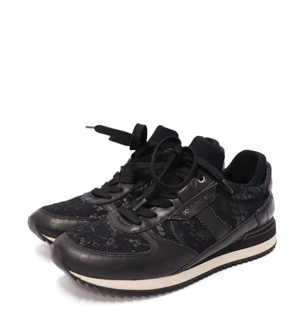 Dolce & Gabbana Black Lace Low-top Buffed Leather Sneakers with a round toe, white strap along the bottom and a rubber sole.

Material: Leather and lace
Size: EU 37
Overall Condition: Good
Interior Condition: Some material are ribbed from the