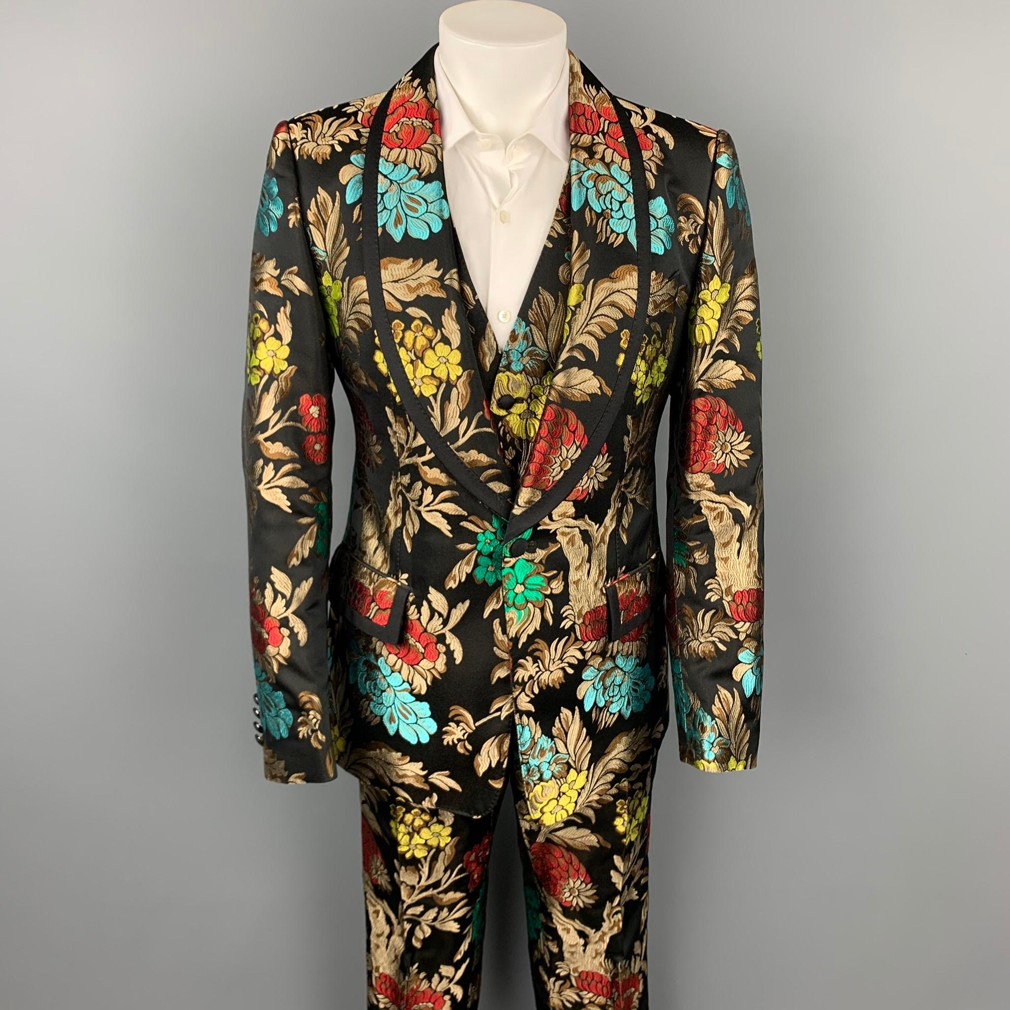 DOLCE & GABBANA F/W 19 3 piece suit comes in black & multi-color brocade acetate blend with a full liner and includes a single breasted, single button sport coat with a shawl lapel and includes a matching vest and matching flat front trousers. Made