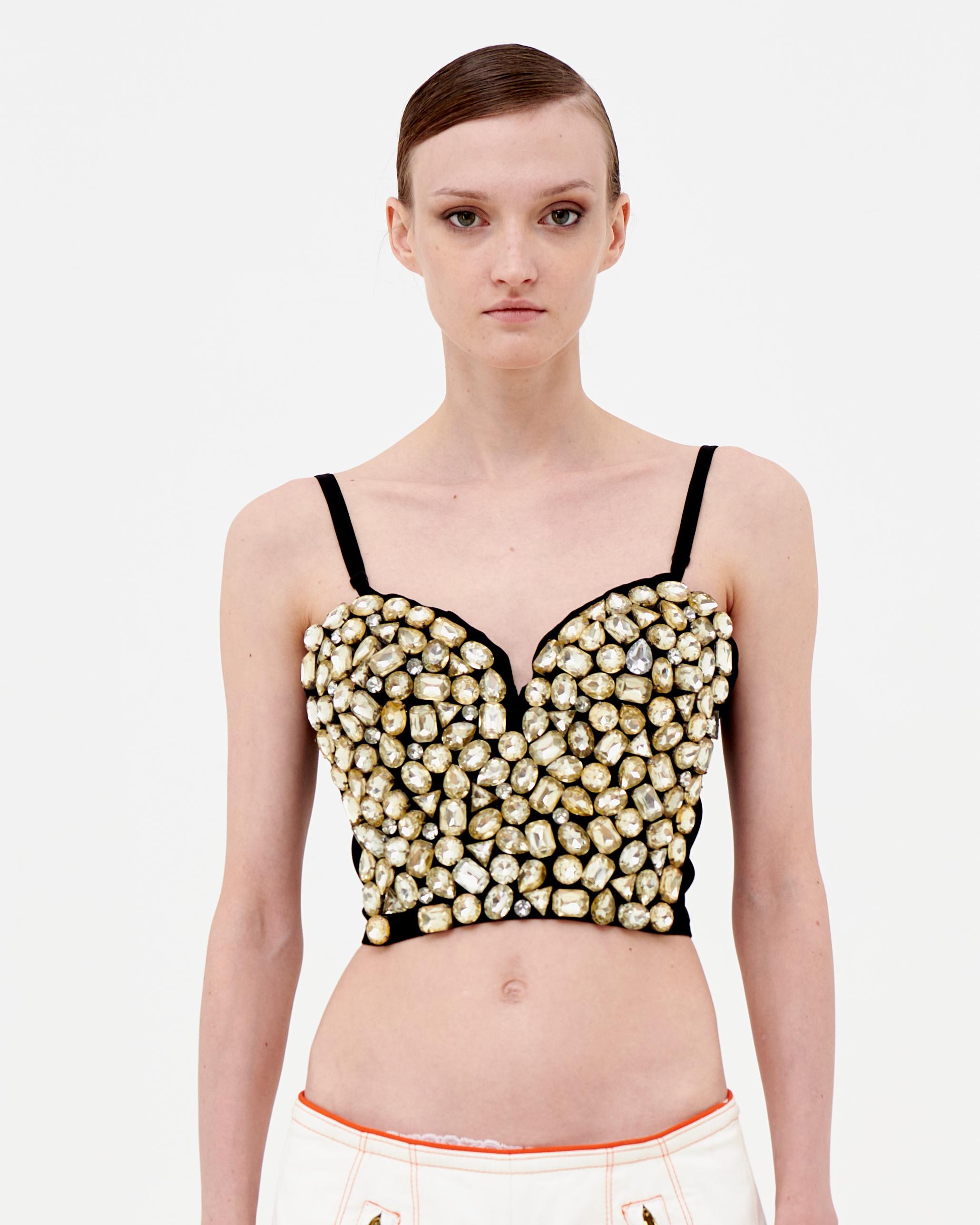 Dolce & Gabbana F/W 1991 Black crop bustier with big chunky crystals and velvet lining. Crystals yellowed a bit over time, one stone is missing.
Extremely rare piece.
Size IT 44, but runs like an XS 
Measurements:
Width: 63 cm/ 25 inch 
Lenght: 23